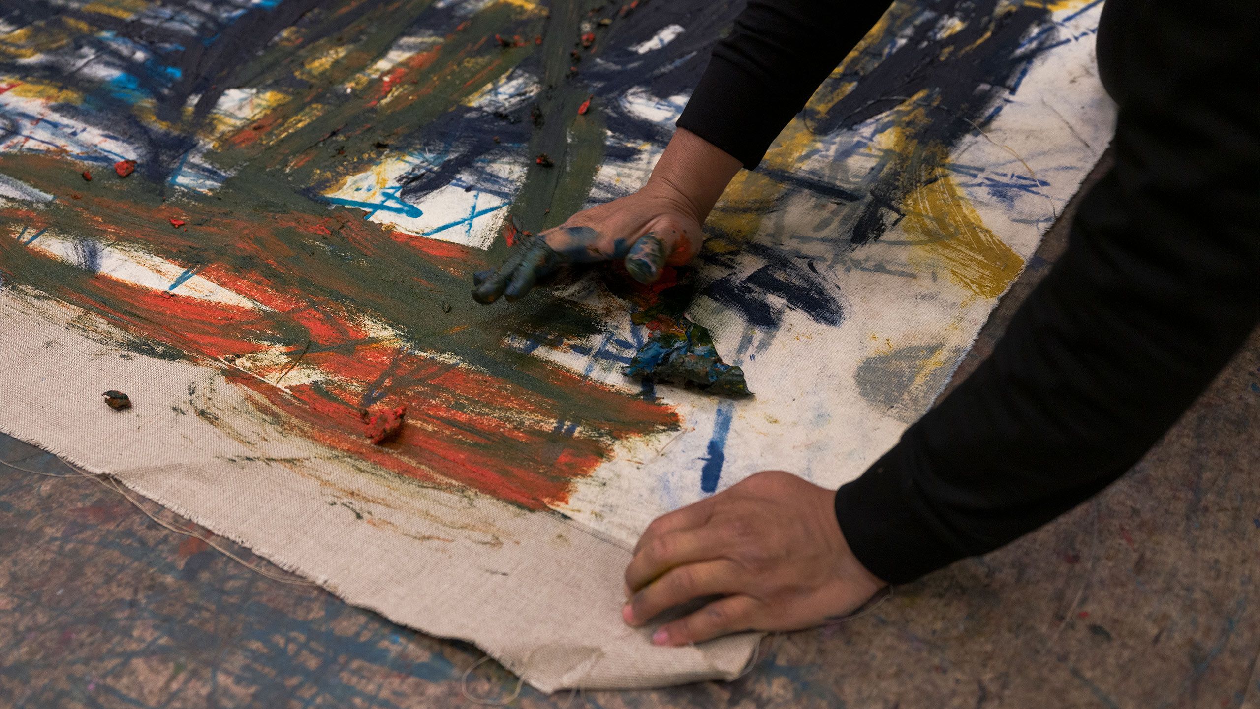 A Photo by Tim Bowditch of Oscar Murillo in his London studio, 2022. 