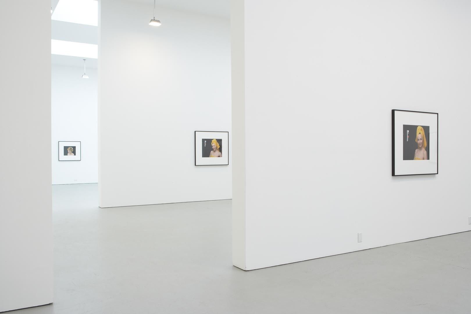 Installation view of the exhibition Christopher Williams: For Example: Dix-Huit Leçons Sur La Société Industrielle (Revision 4), at David Zwirner in New York, dated 2006.