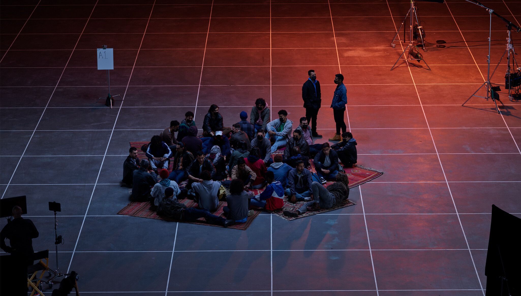 A Photo by Evaan Kheraj of  Actors on set at the PNE Agrodome, Vancouver, dated 2021. 