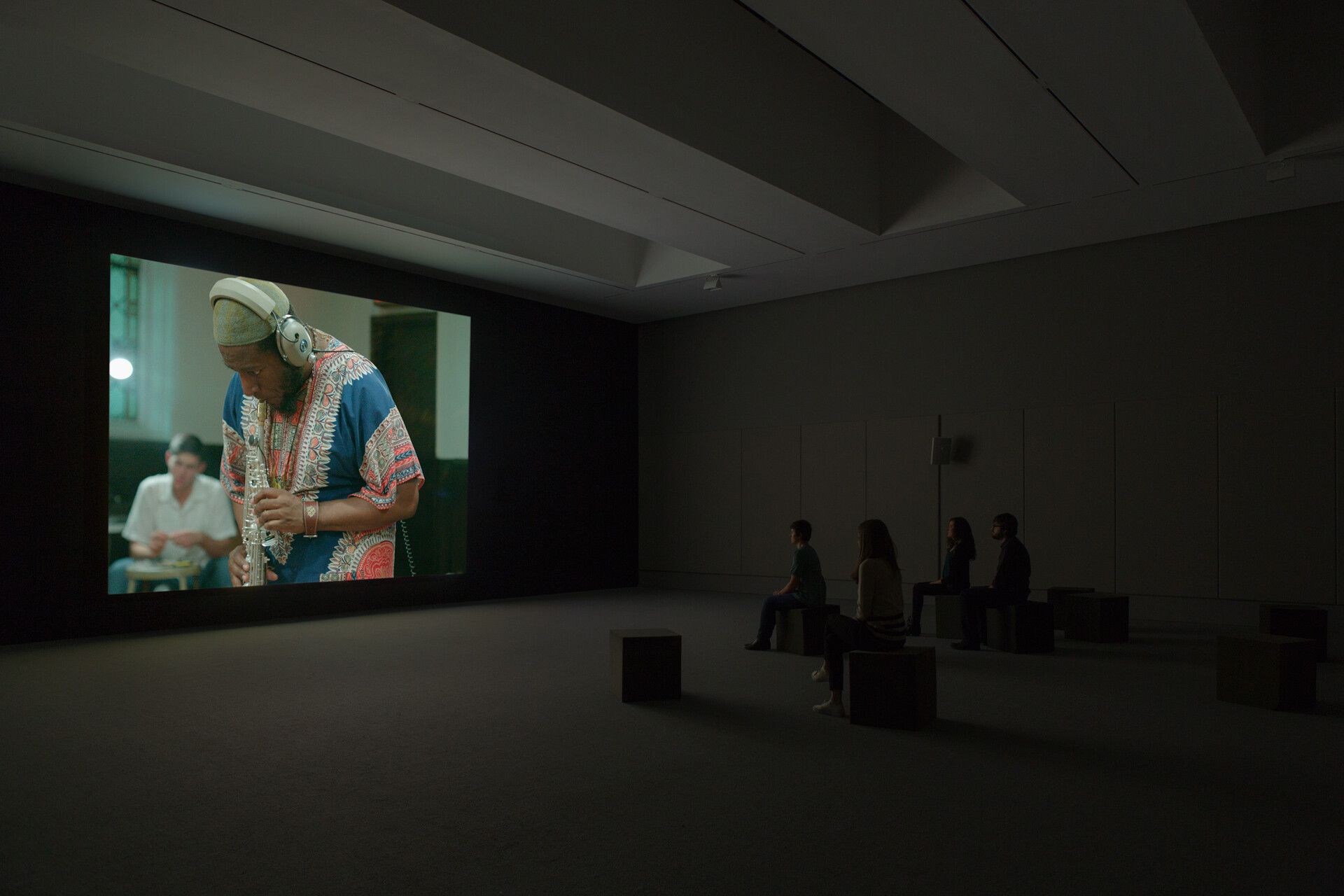 An installation view of a work by Stan Douglas, titled Luanda-Kinshasa, dated 2013.