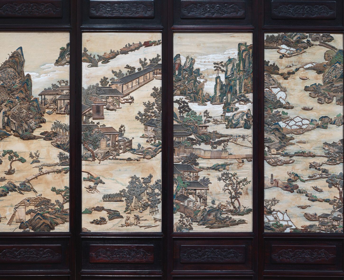 A detail of a Chinese folding screen with figures in a landscape, nineteenth century