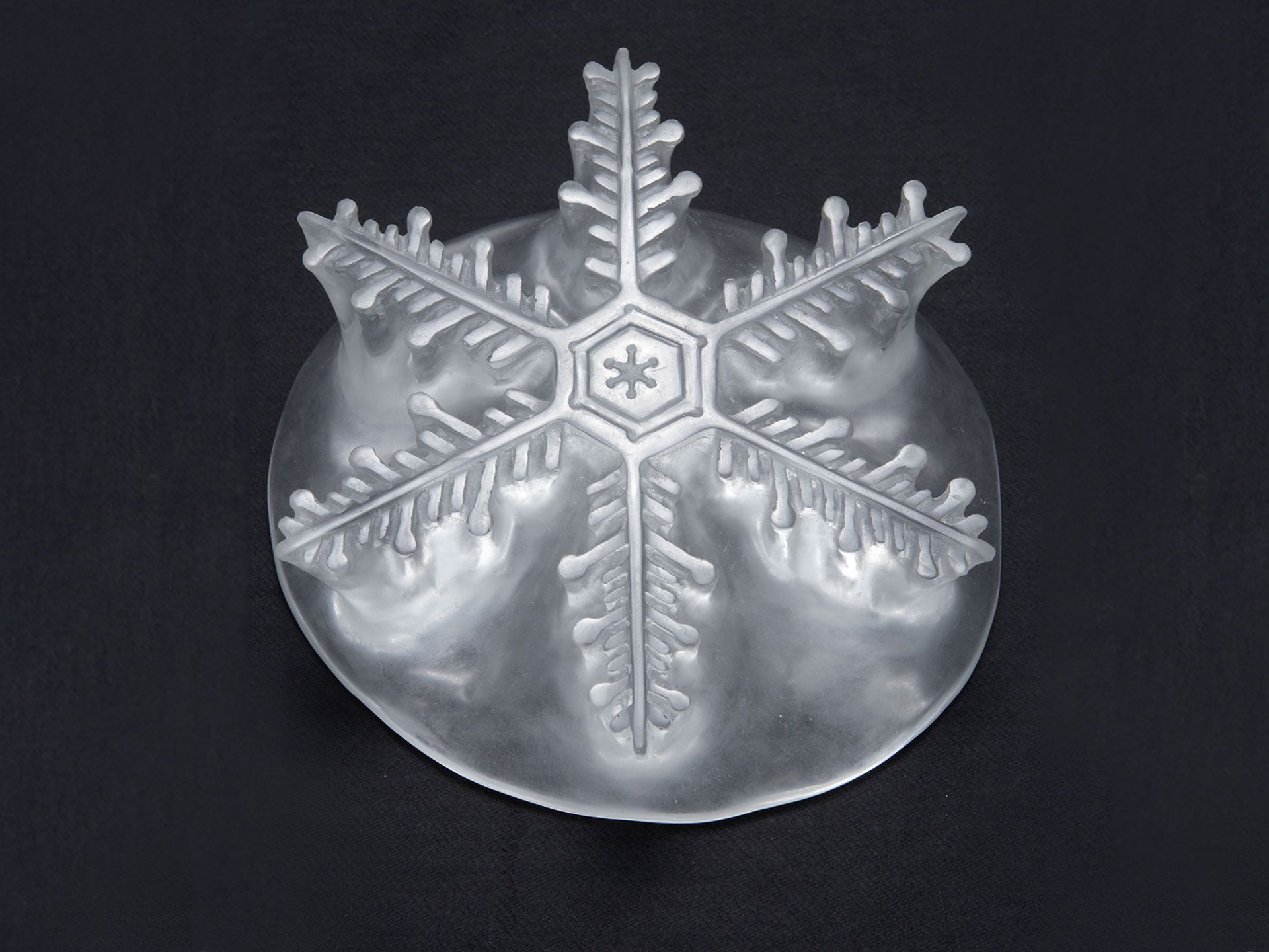 A crystal sculpture by Yutaka Sone, titled Every Snowflake has a Different Shape (medium) No. 10, dated 2007. 