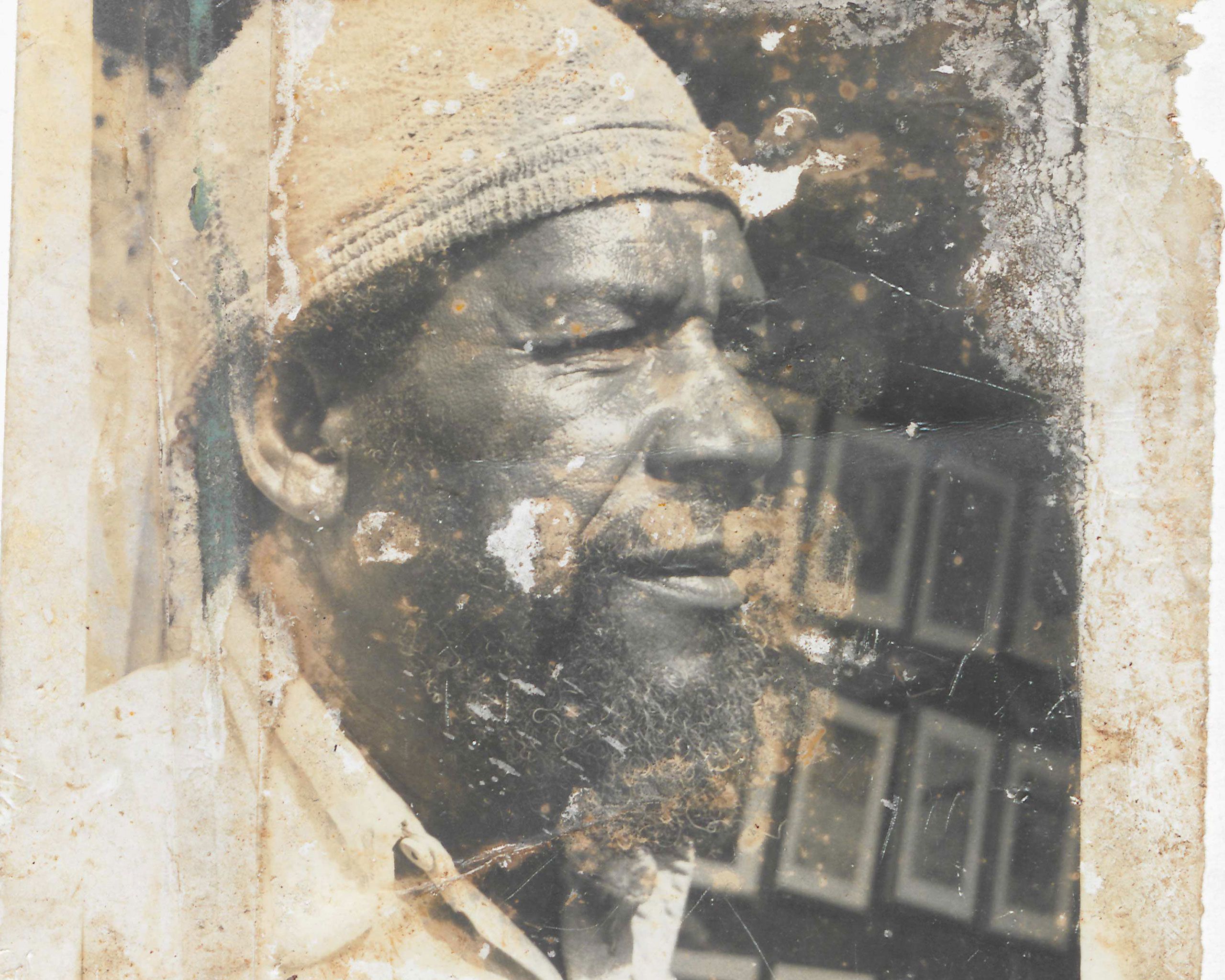 A photograph of Frank Walter in his studio on Market Street in St. John’s, Antigua, dated 1987.