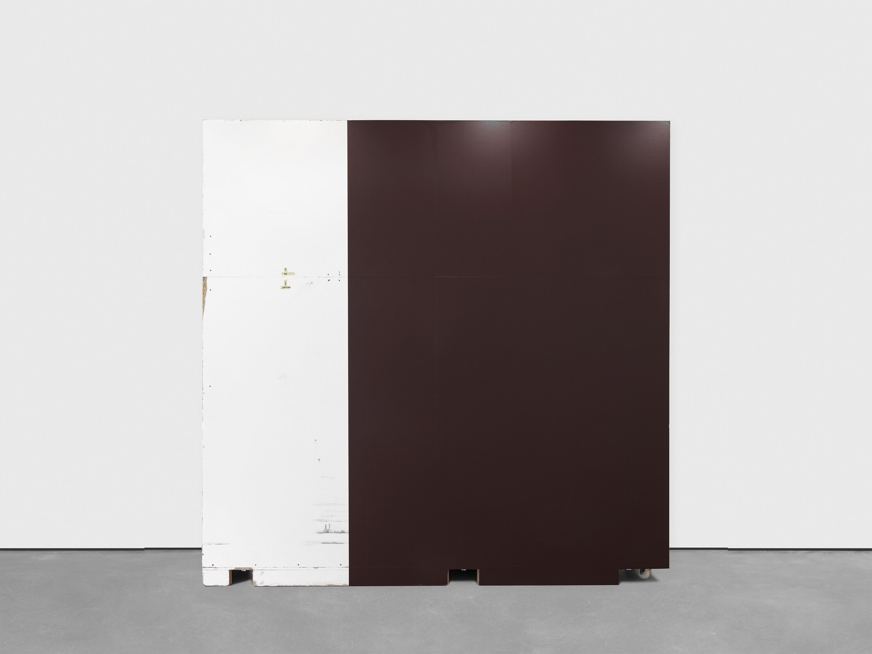 A mixed media artwork by Christopher Williams, titled Wall designed by Dirk Ufermann, Head Technician, Bonner Kunstverein, Bonn. Constructed by Objekt Design Persighetti Ltd. for the exhibition Open Letter: The Family Drama Refunctioned? (From the Point of View of Production), 17 March - 20 May, 2017, David Zwirner, London after drawings by Pasztori Simons Architects, Berlin with Avery Dennison 500 Event Film Matt vinyl (color code: 707EM) installed by Imga Imaging Ltd. Kent, UK (6/6) 2017 Plywood, metal, wood, and adhesive vinyl 350 x 350 x 57 cm Wall constructed by Objekt Design Persighetti Ltd, Leichlingen, Germany Vinyl installed by Igma Imaging Ltd., Kent, UK (6/6),  dated 2017. 