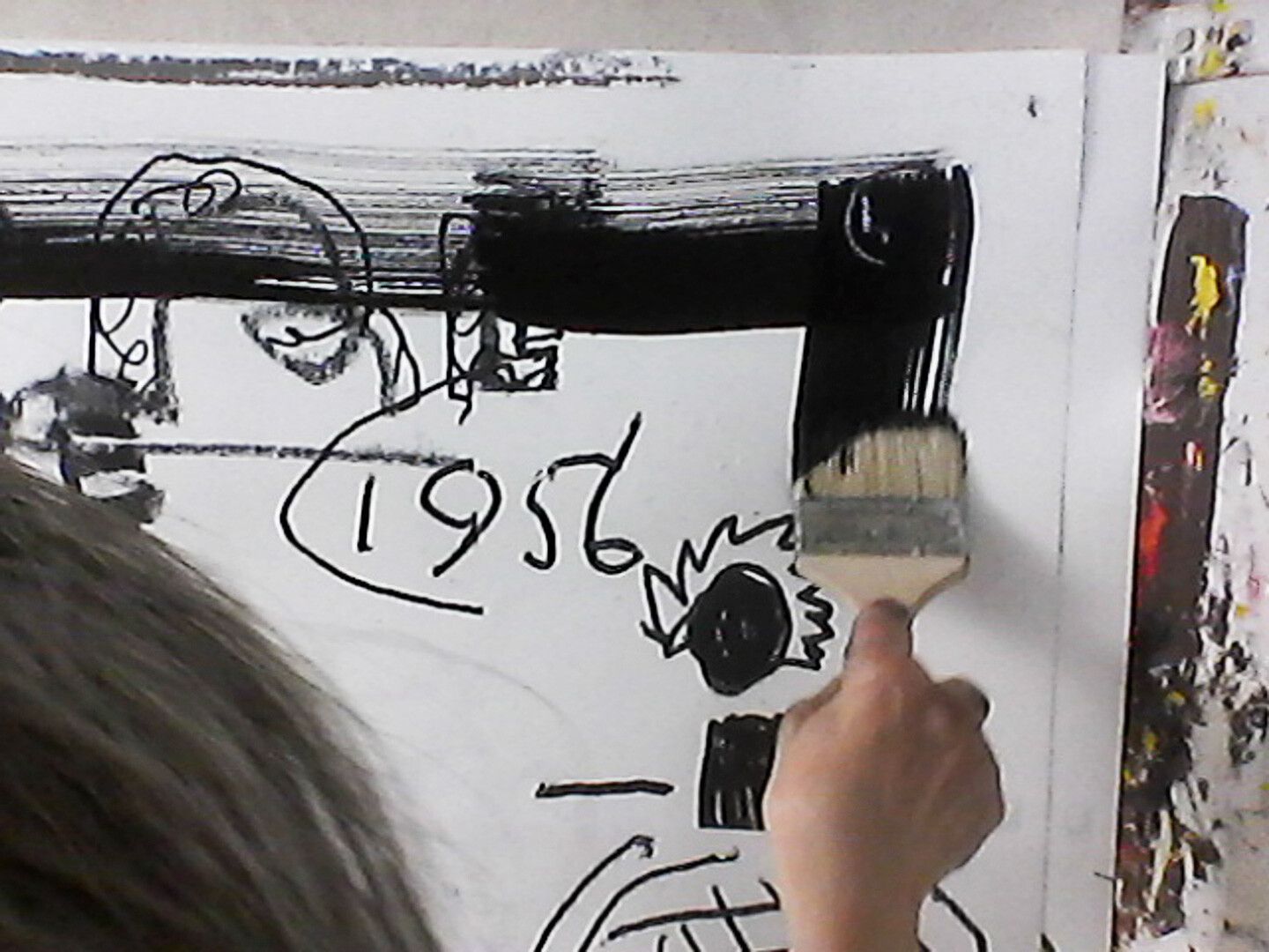 A photograph of Rose Wylie in her studio, dated 2019