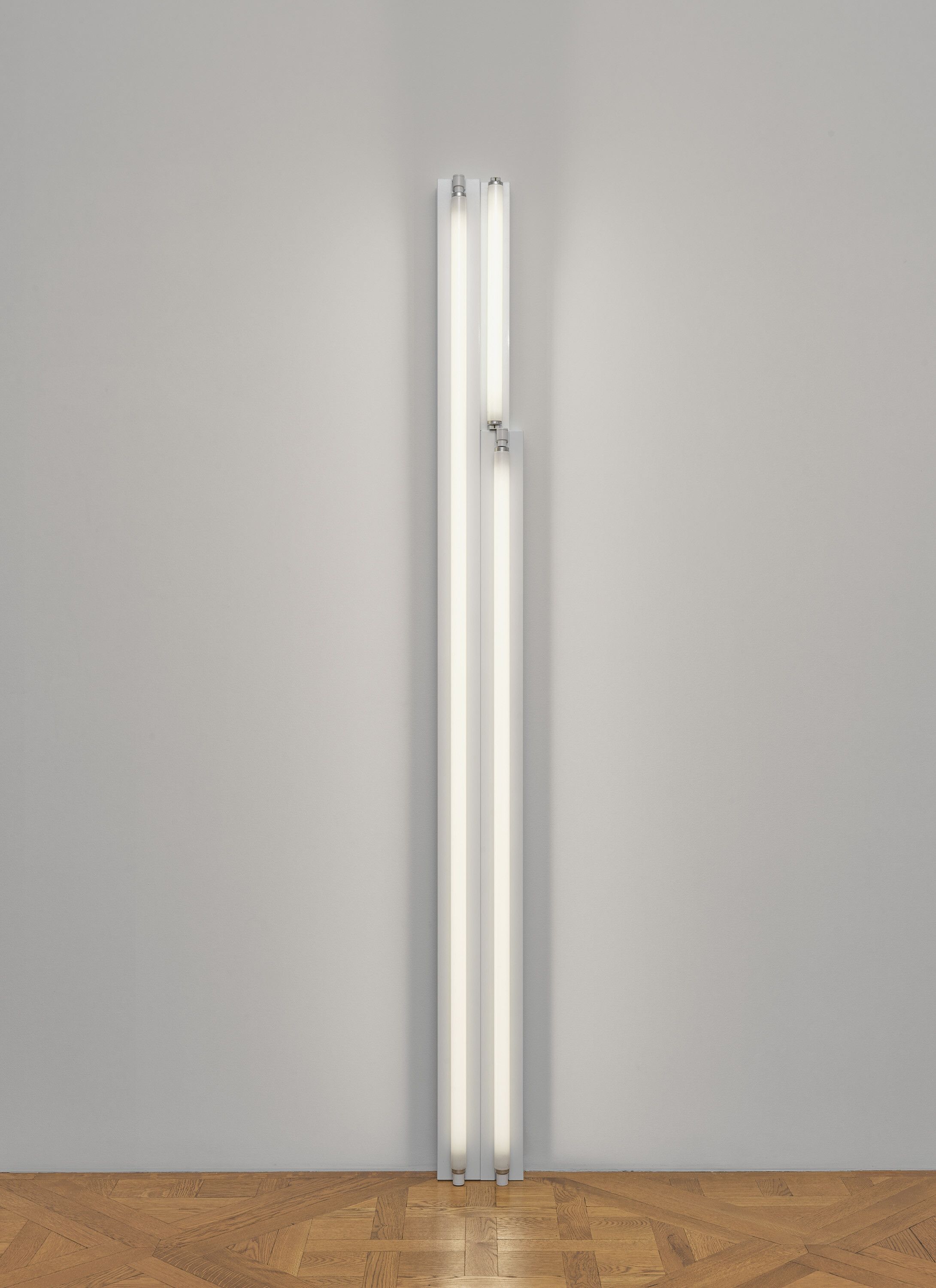 A cool white fluorescent light sculpture by Dan Flavin, called untitled, dated 1967.
