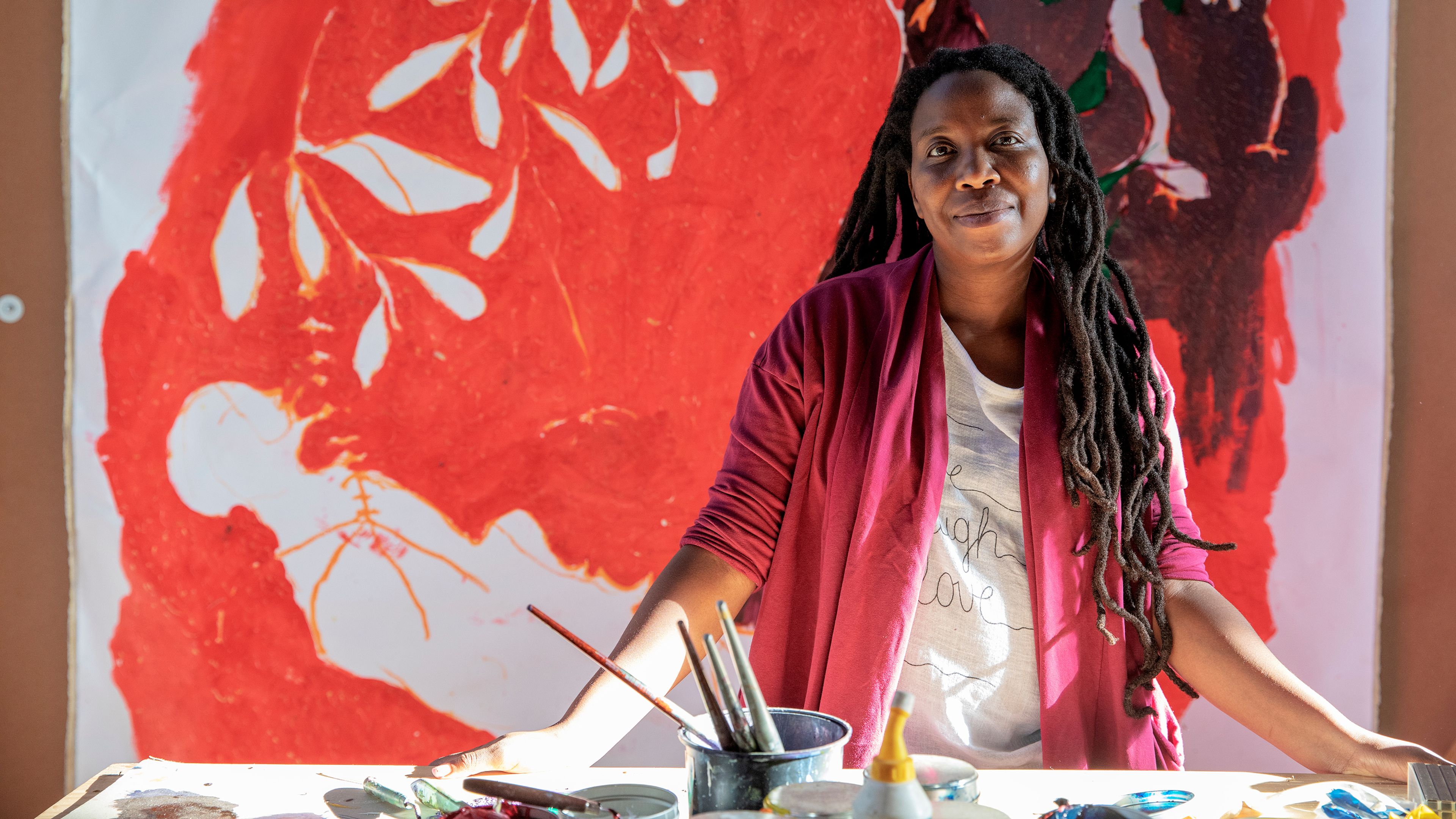 Photograph of Portia Zvavahera in her studio by Gianluigi Guercia, dated 2023.