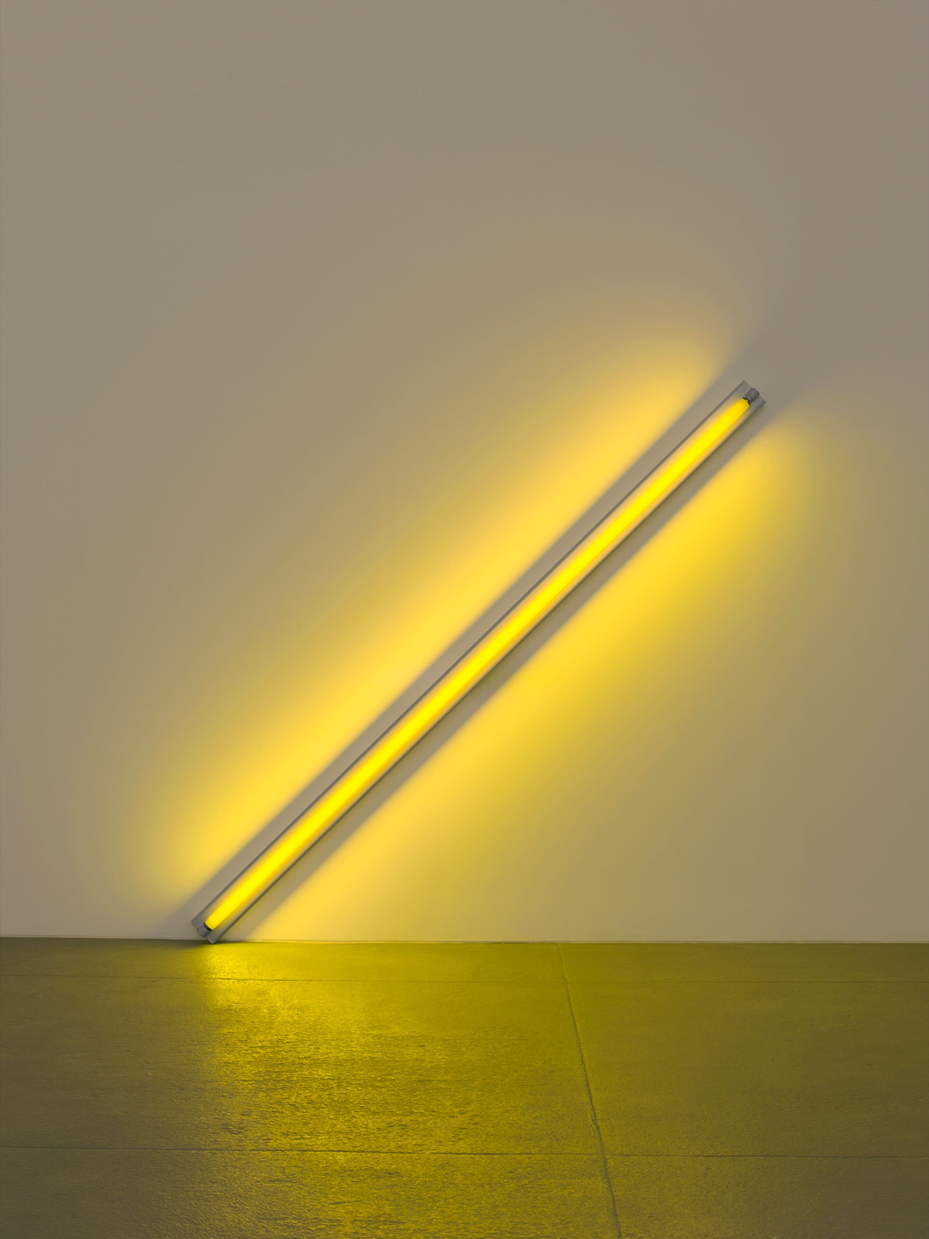 A sculpture in yellow fluorescent light by Dan Flavin, titled the diagonal of May 25, 1963 (to Constantin Brancusi), dated 1963.