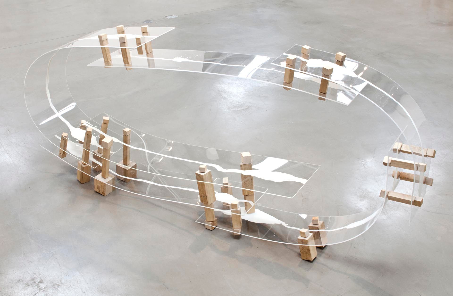 A sculpture by Al Taylor, titled Endless Puddle, dated 1990.