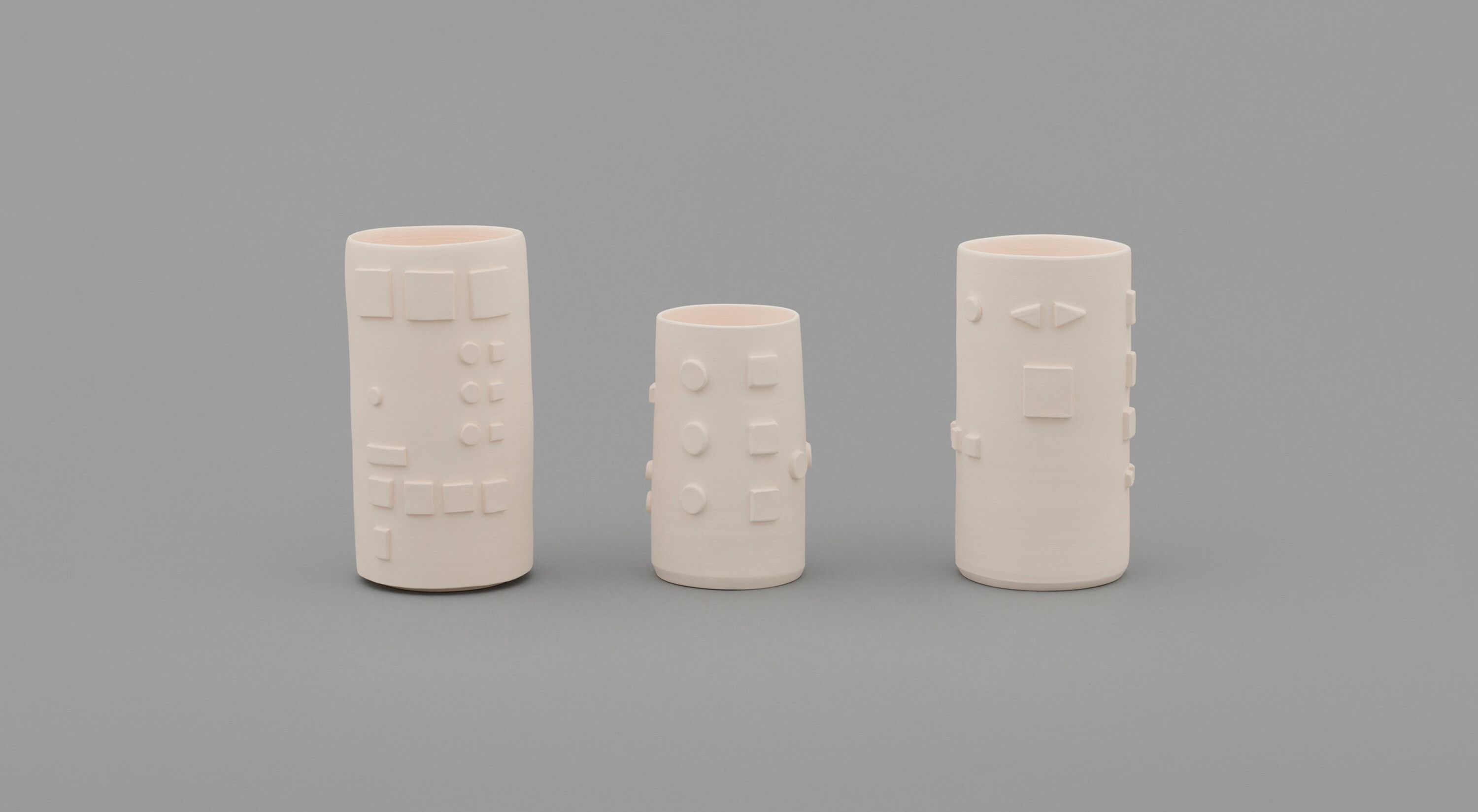 A three part porcelain artwork by Shio Kusaka, titled (machine 1), dated 2021.