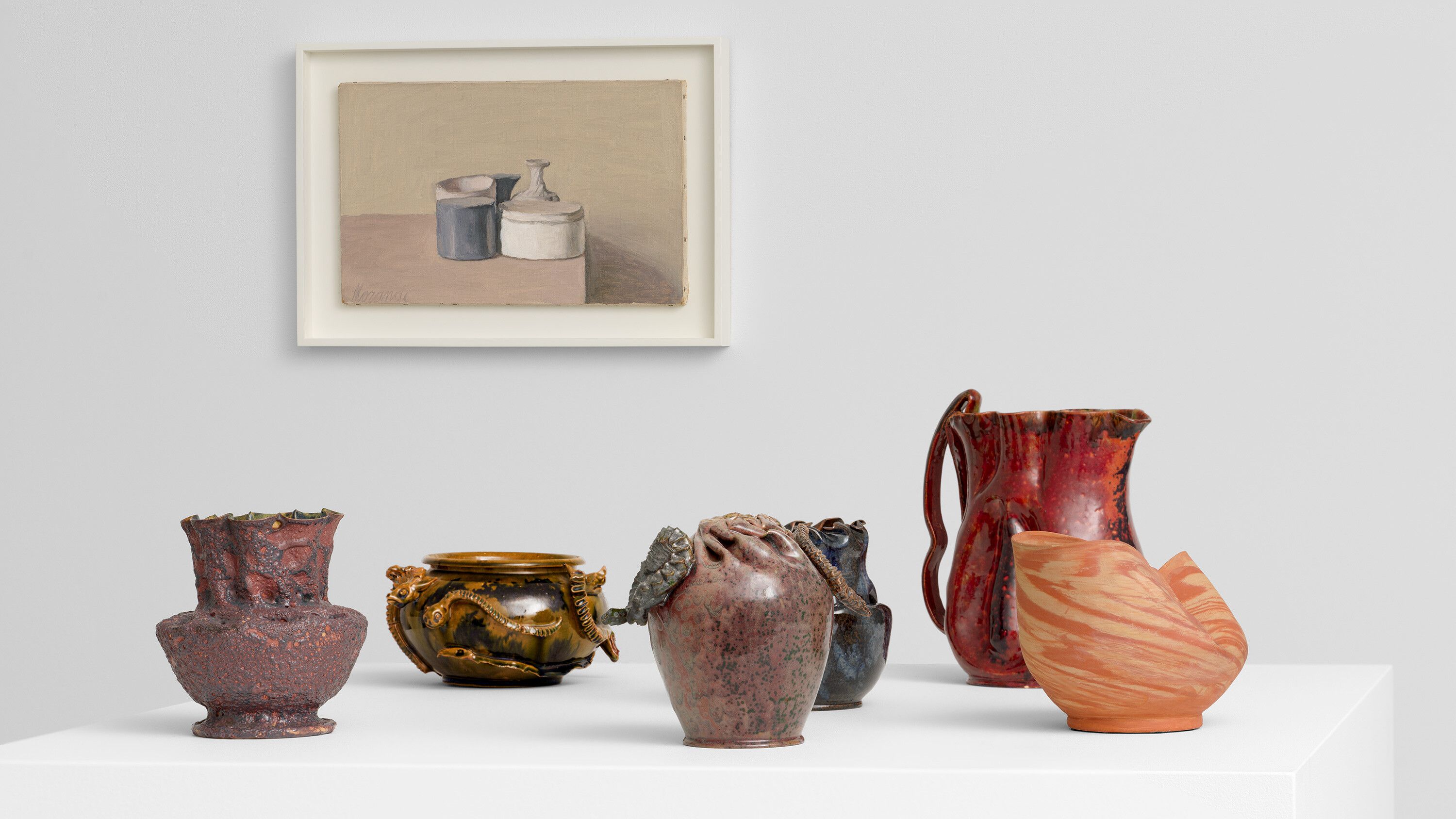 Install image of works by George Ohr and Giorgio Morandi for TEFAF 2024.