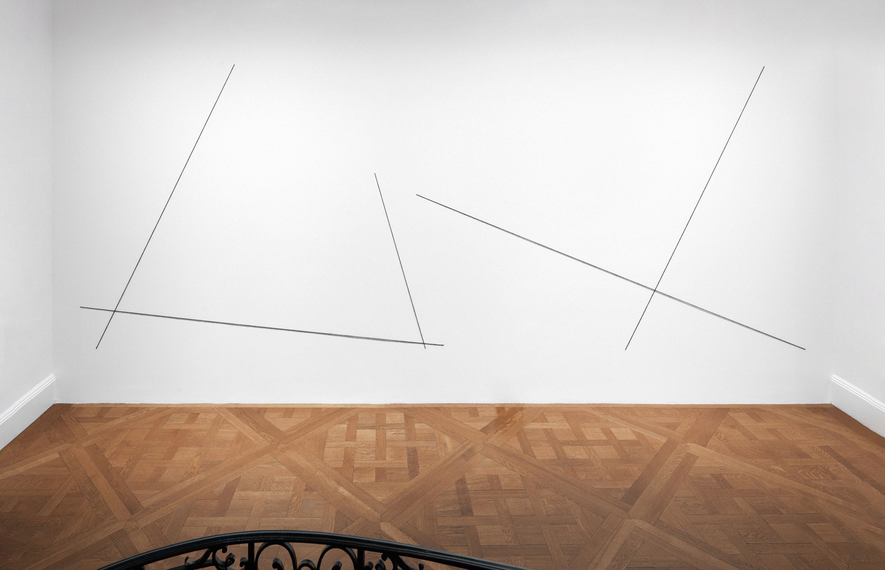 A black acrylic yarn artwork by Fred Sandback, titled Untitled, Mikado (Sculptural Study, Wall Construction), dated in 2001 and 2013.