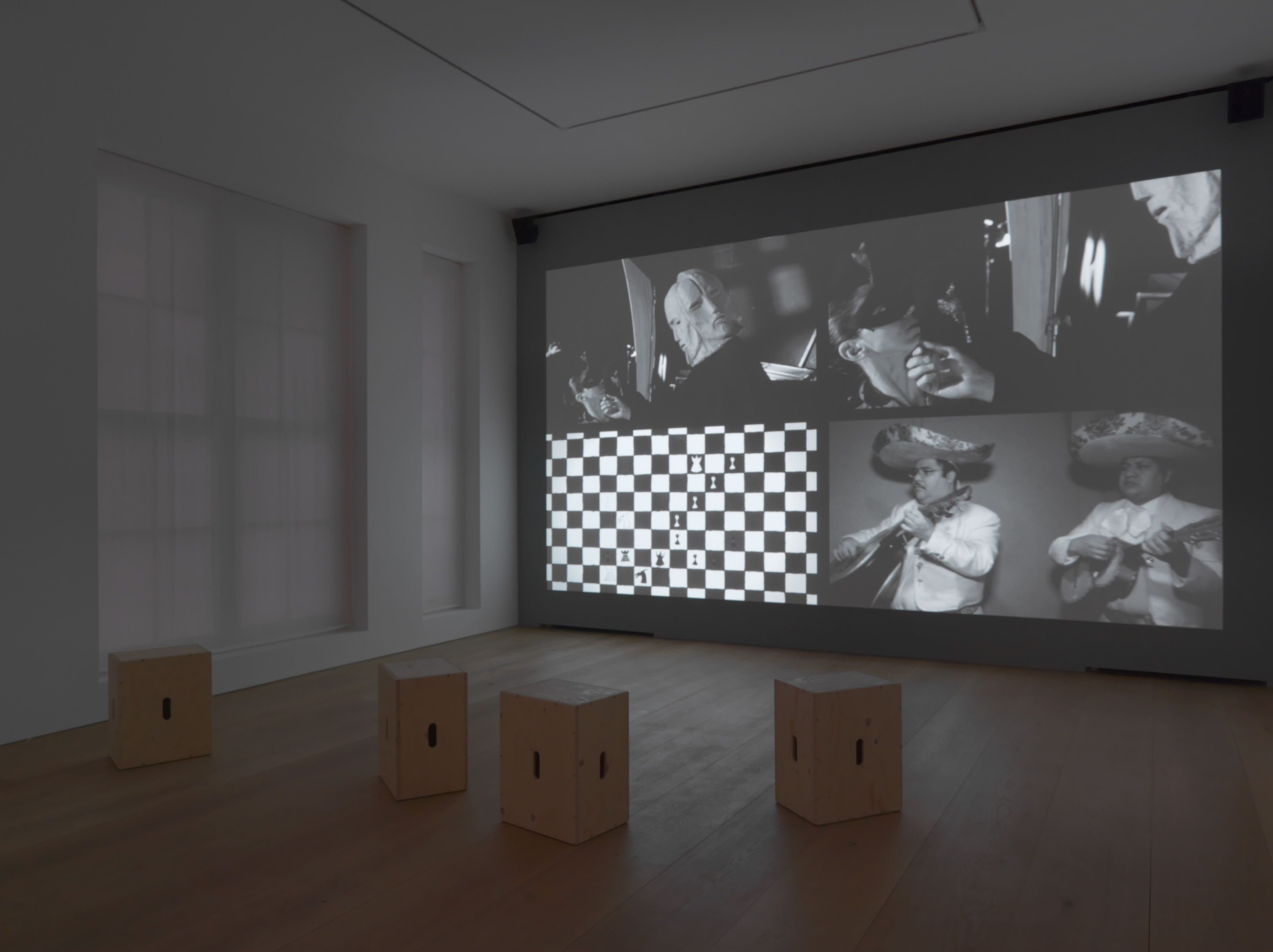 An installation view of a video work by Marcel Dzama, titled Sister Squares, dated 2012.