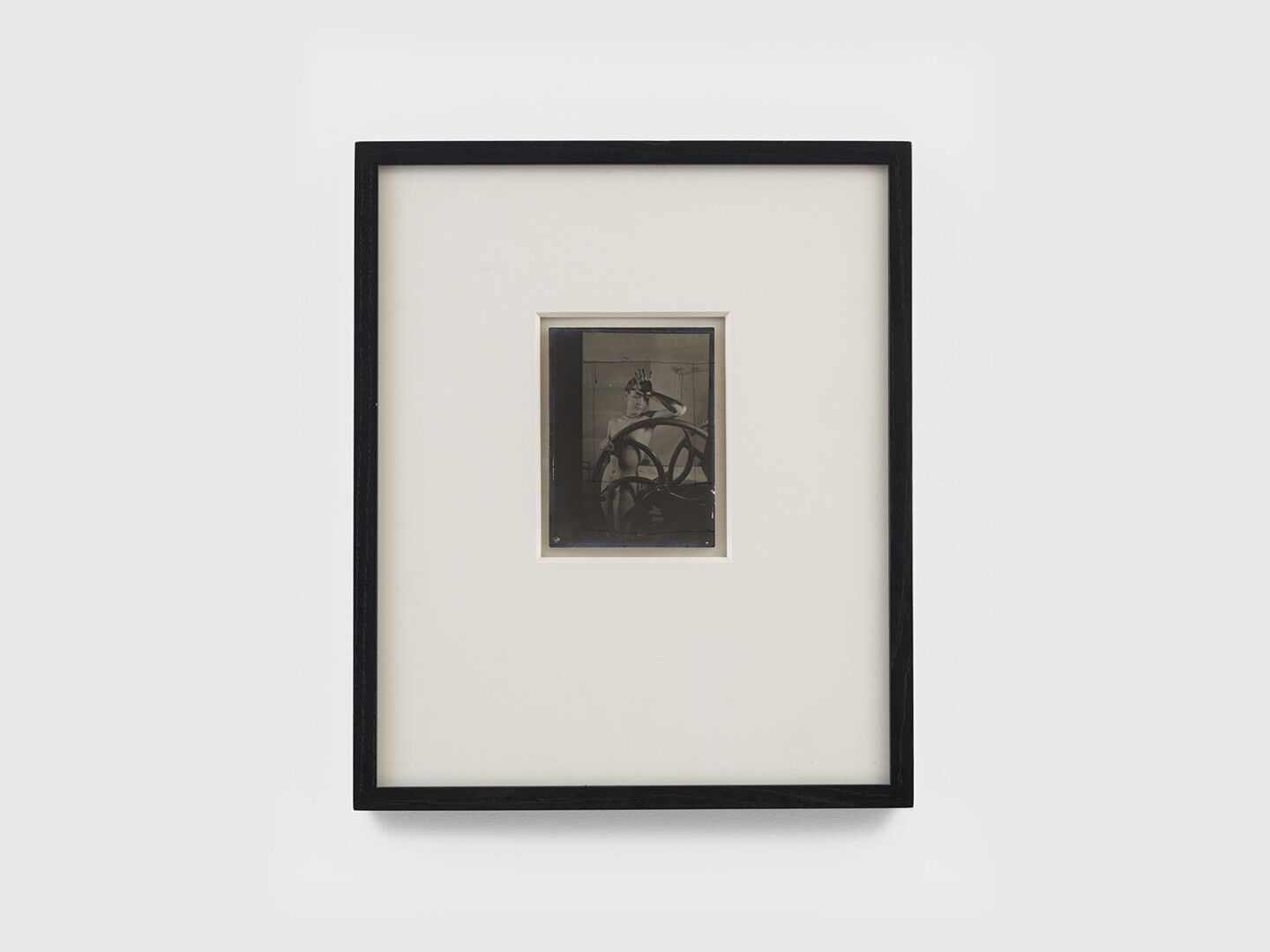 A photograph by Man Ray, titled √ârotique voil√©e, translated as Veiled Erotic, dated 1933.
