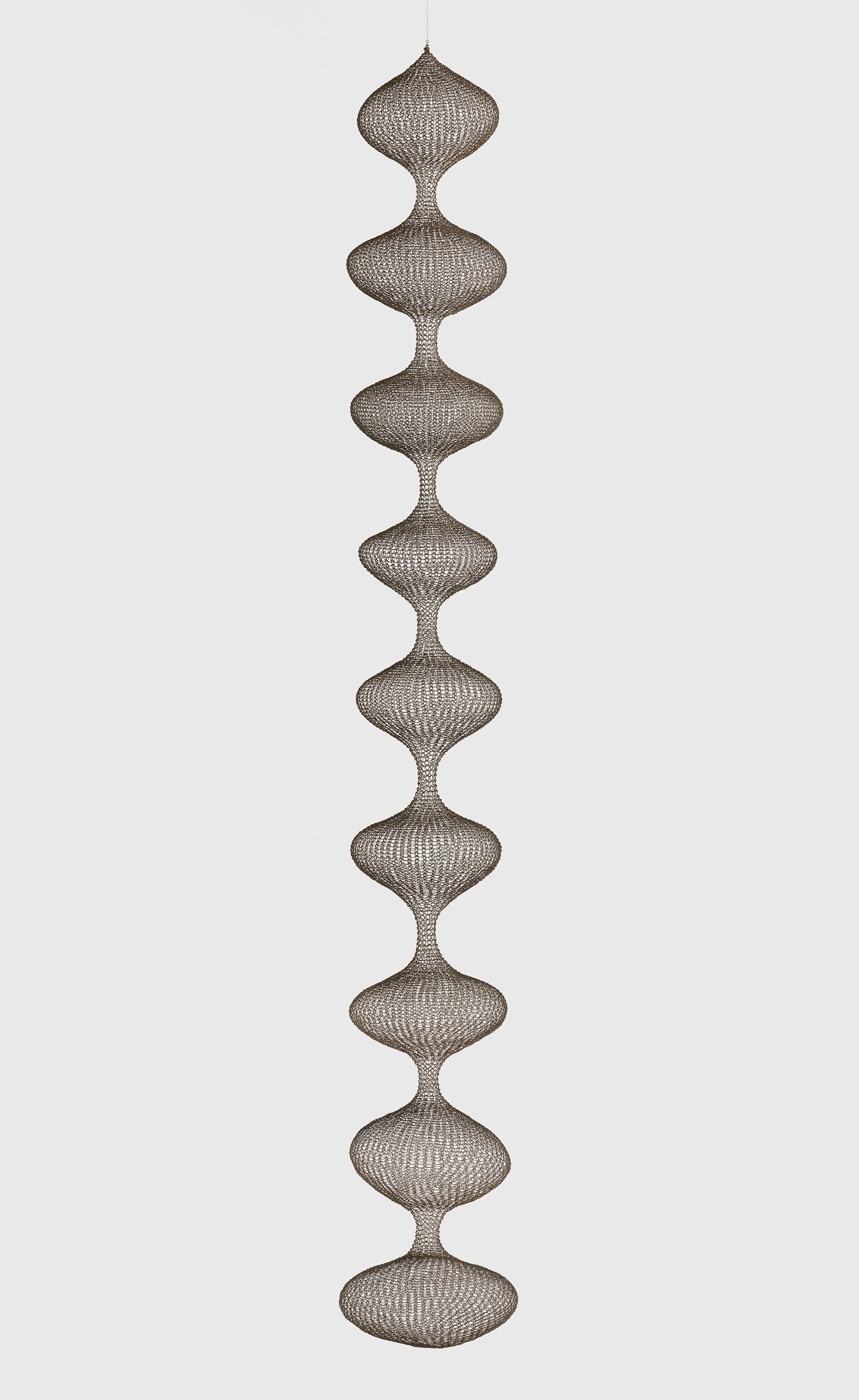 A sculpture by Ruth Asawa, called Untitled (S.278, Hanging Nine-Lobed, Single-Layered Continuous Form), dated circa 1955.
