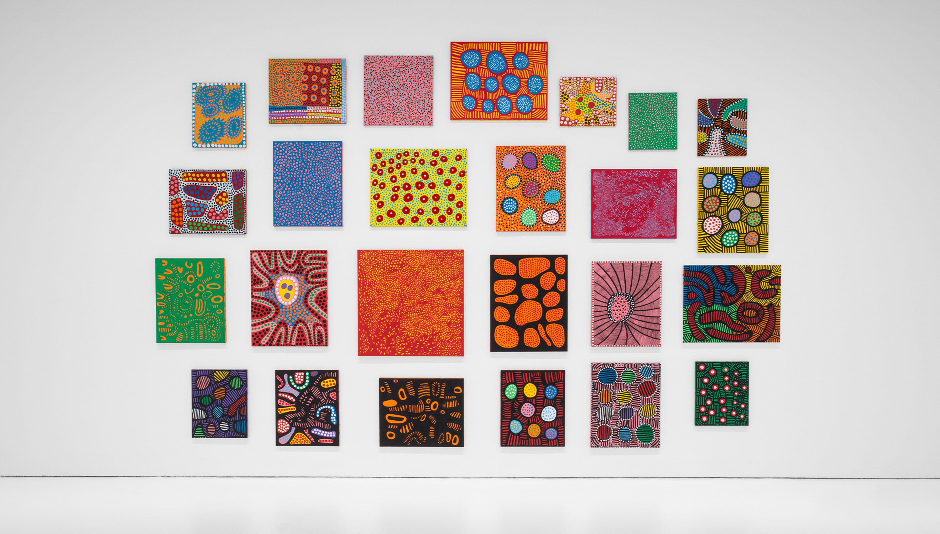 An installation view of the exhibition titled Yayoi Kusama, I Spend Each Day Embracing Flowers, dated 2023