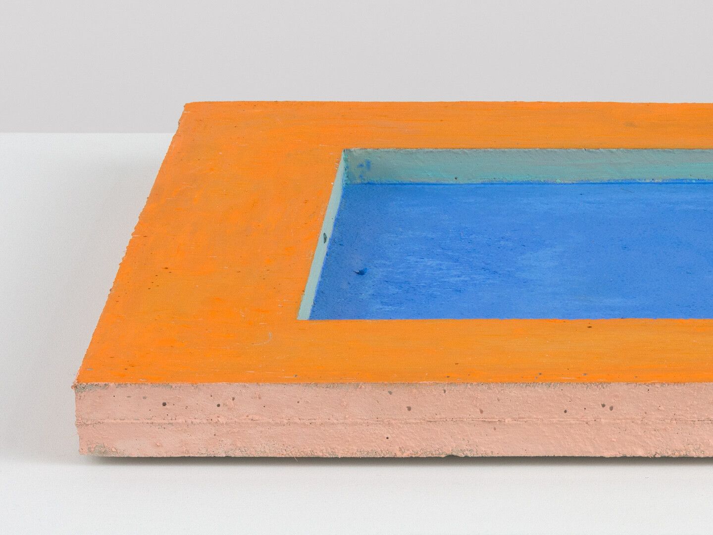 Detail view of an untitled oil stick on concrete sculpture by Harold Ancart, dated 2020.