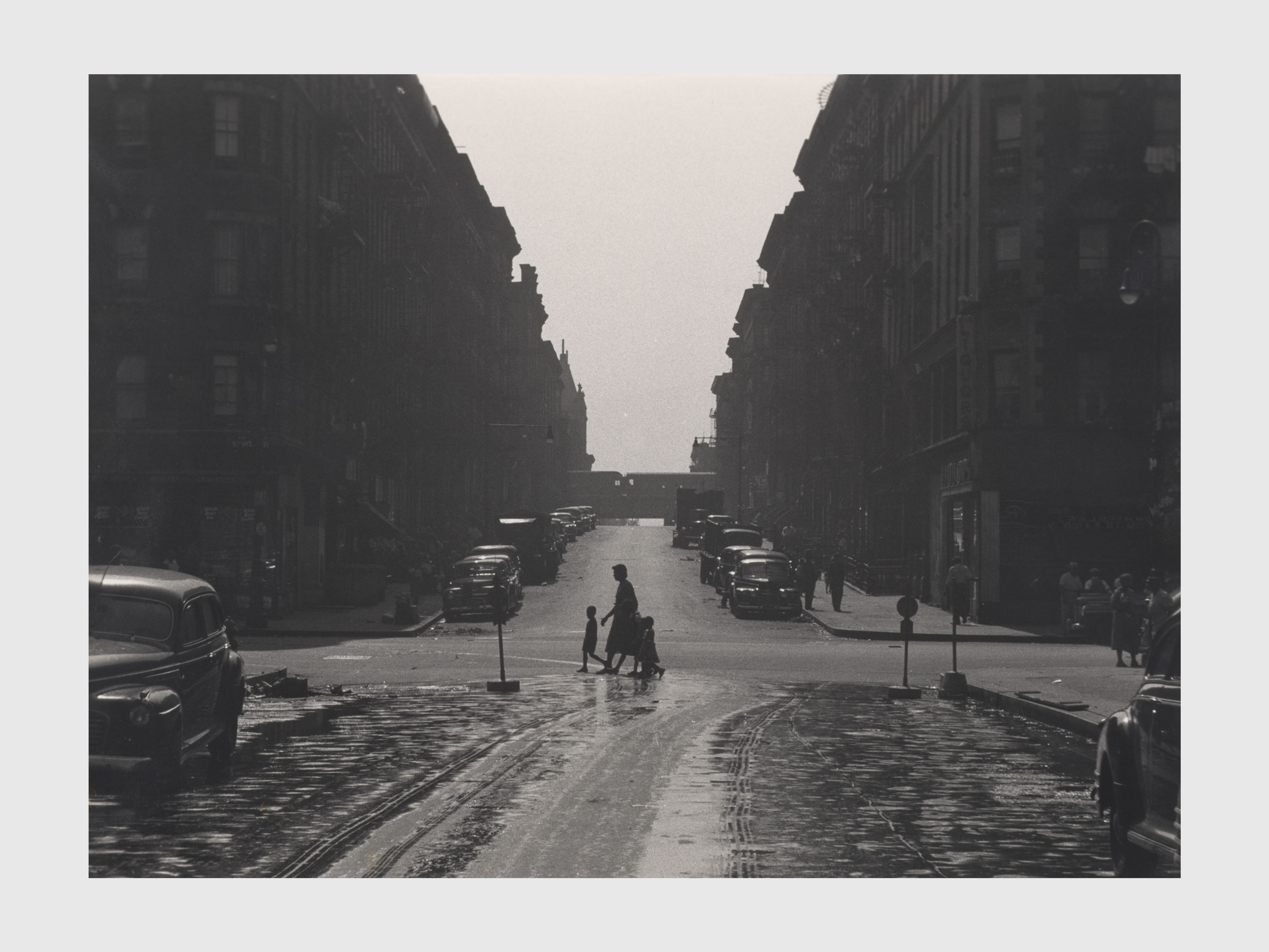 A photograph by Roy de Carava titled Woman and children at intersection, dated 1952.