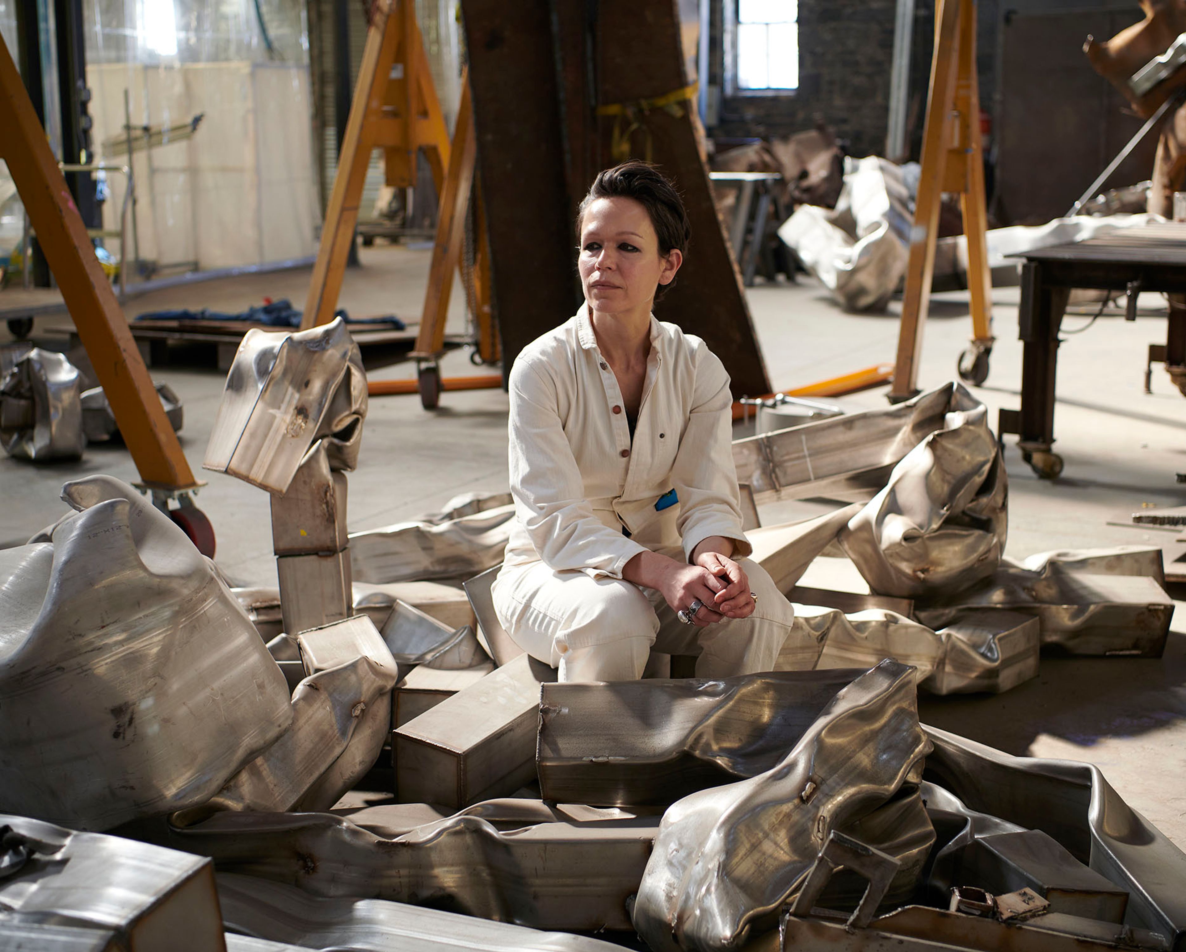 A photo of Carol Bove in her studio by Jason Schmidt dated 2019.