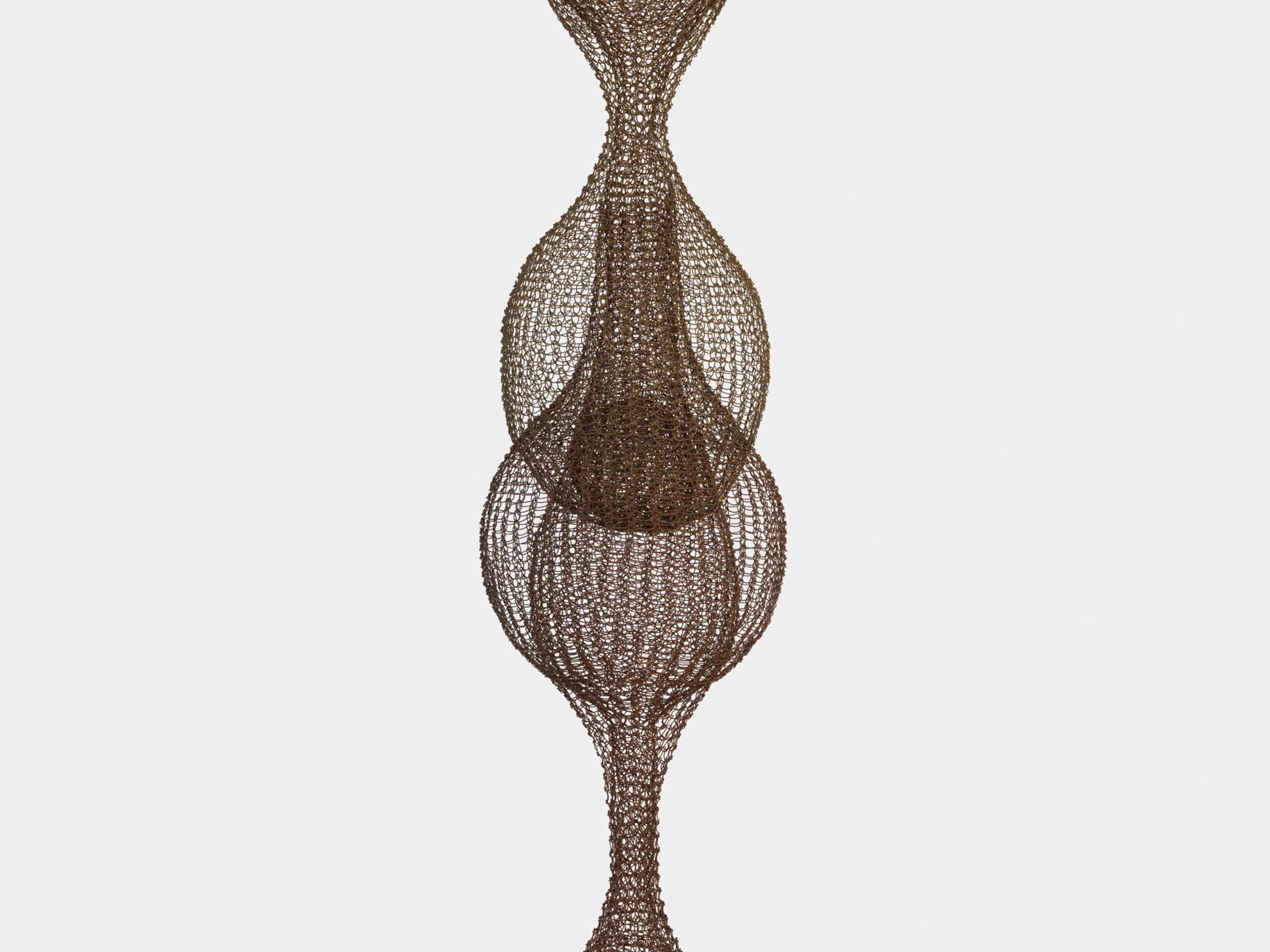 A detail of a sculpture by Ruth Asawa, titled Untitled (S.065, Hanging Seven-Lobed, Multi-Layer Continuous Form within a Form), dated circa 1960 to 1963.