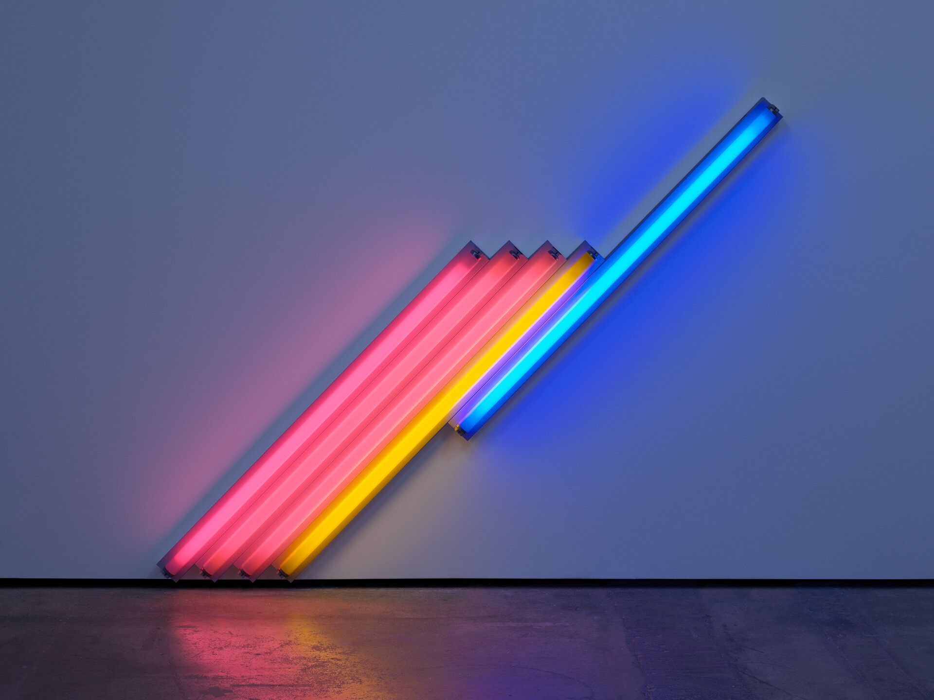 A pink, yellow, and blue fluorescent light sculpture by Dan Flavin, titled untitled (for Frederika and Ian) 3, dated 1987.