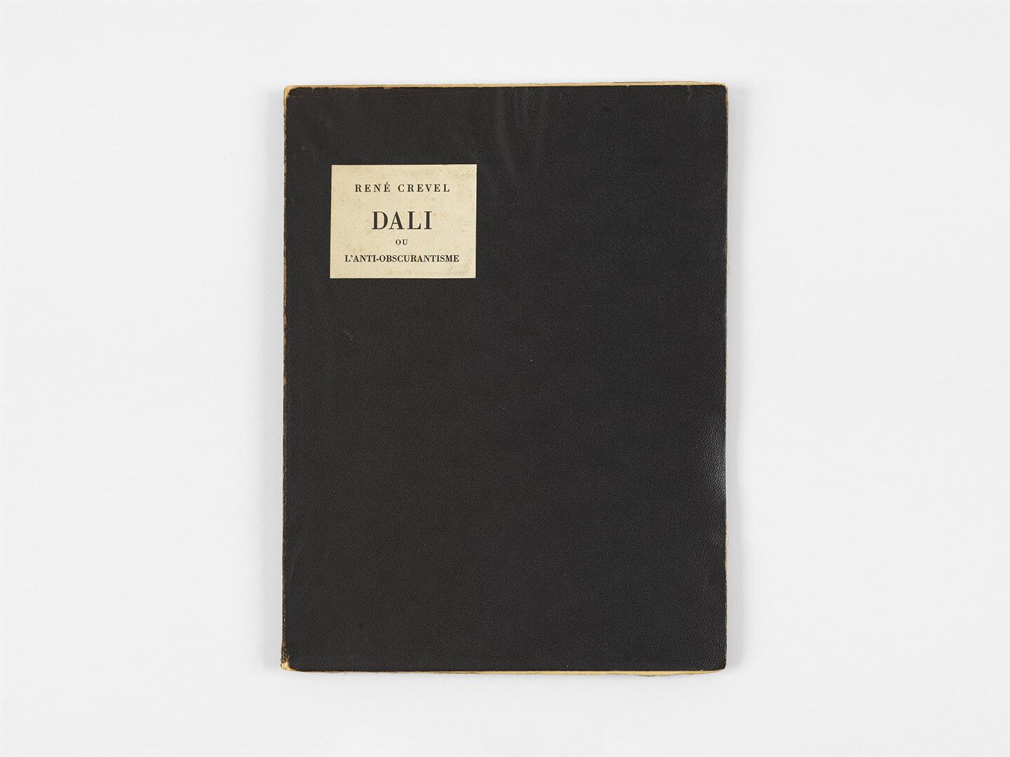 A book by Ren√© Crevel, titled Dal√≠ ou l'anti-obscurantisme, translated as Dal√≠ or Anti-obscurantism, dated 1931. 