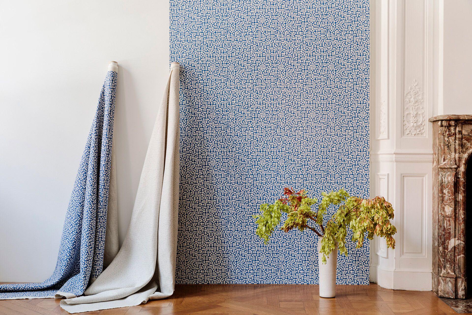 A photograph featuring textile patterns and wallpaper from Anni Albers, dated 2019