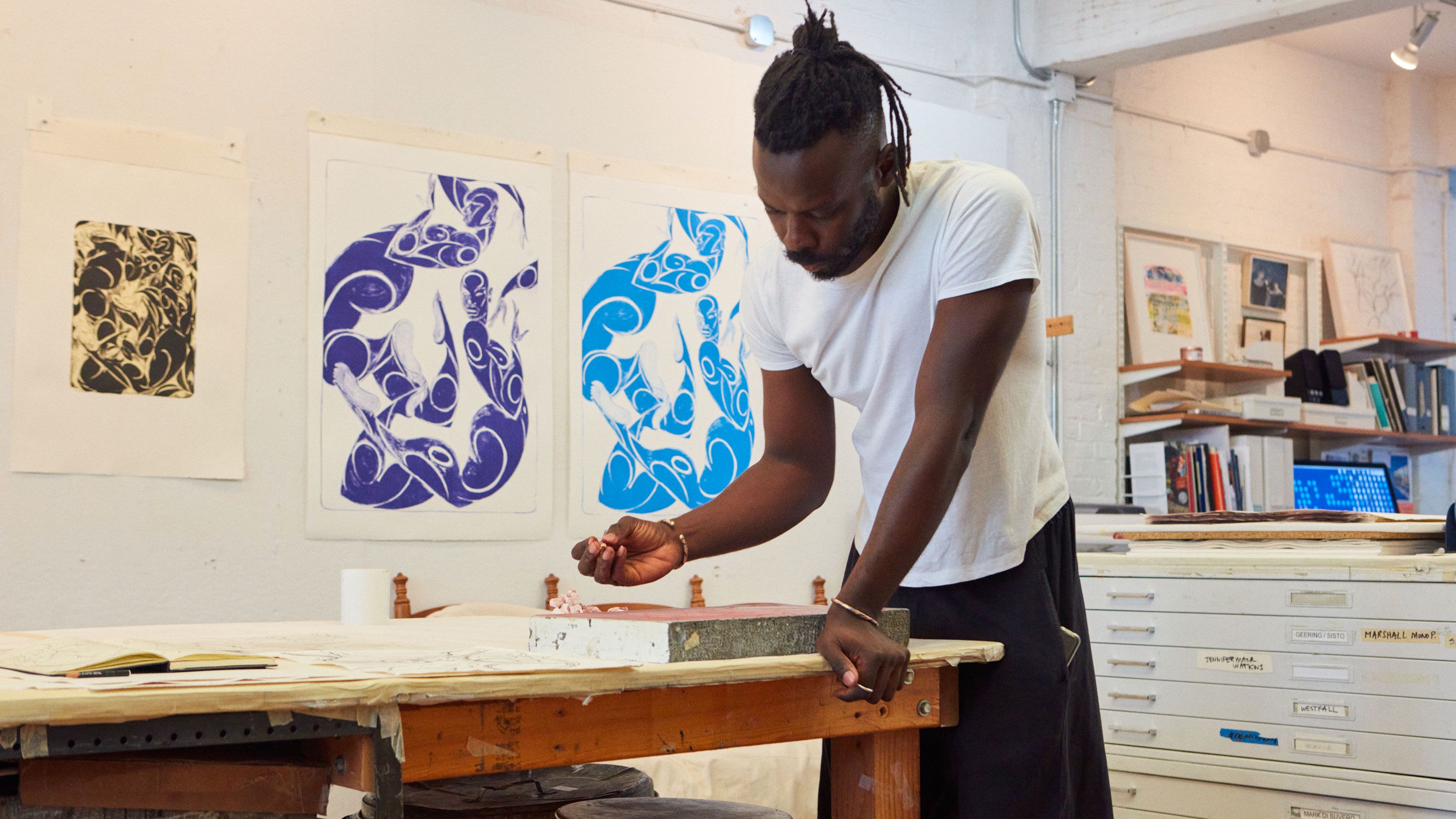 This photograph features Adeniyi-Jones working at Jungle Press Editions print shop, dated 2022. Photo by Rafael Rios