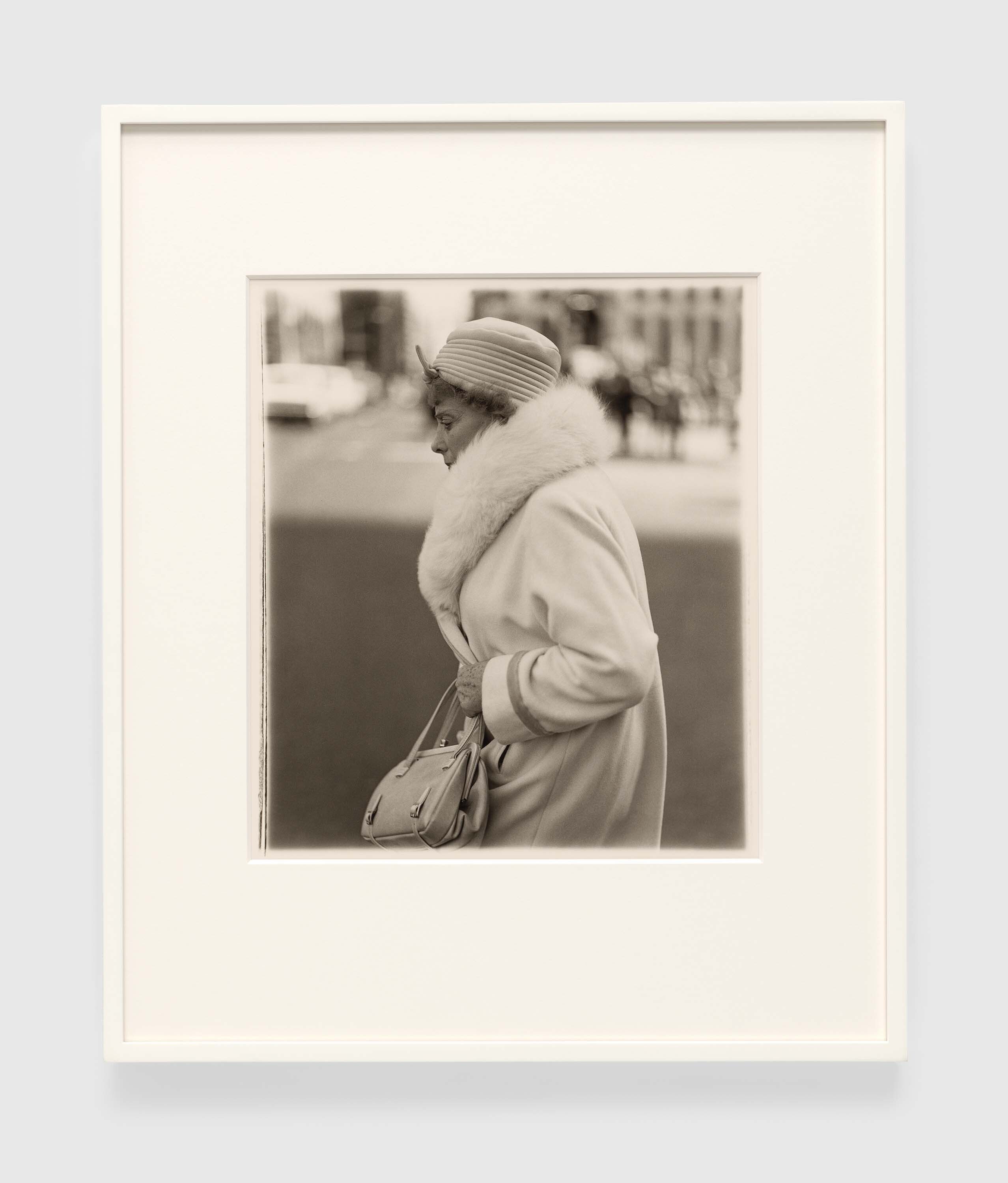 A gelatin silver print by Diane Arbus, titled A woman passing on the street, N.Y.C. 1971, dated 1971.