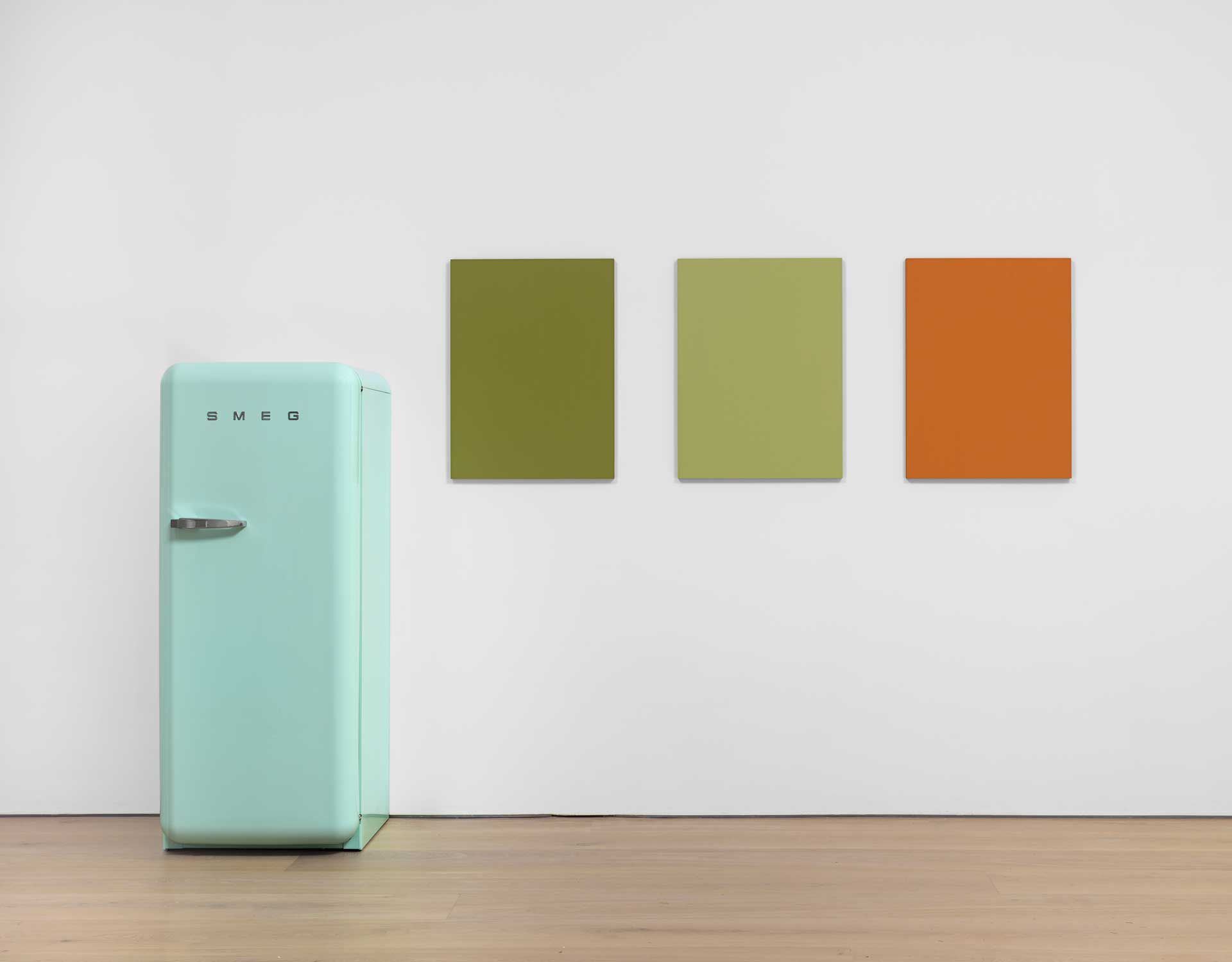 A work by Sherrie Levine comprised of Three oil on mahogany paintings and one SMEG 50s Retro Style refrigerator, titled Pastel Green SMEG Refrigerator and Renoir Nudes, dated 2016.