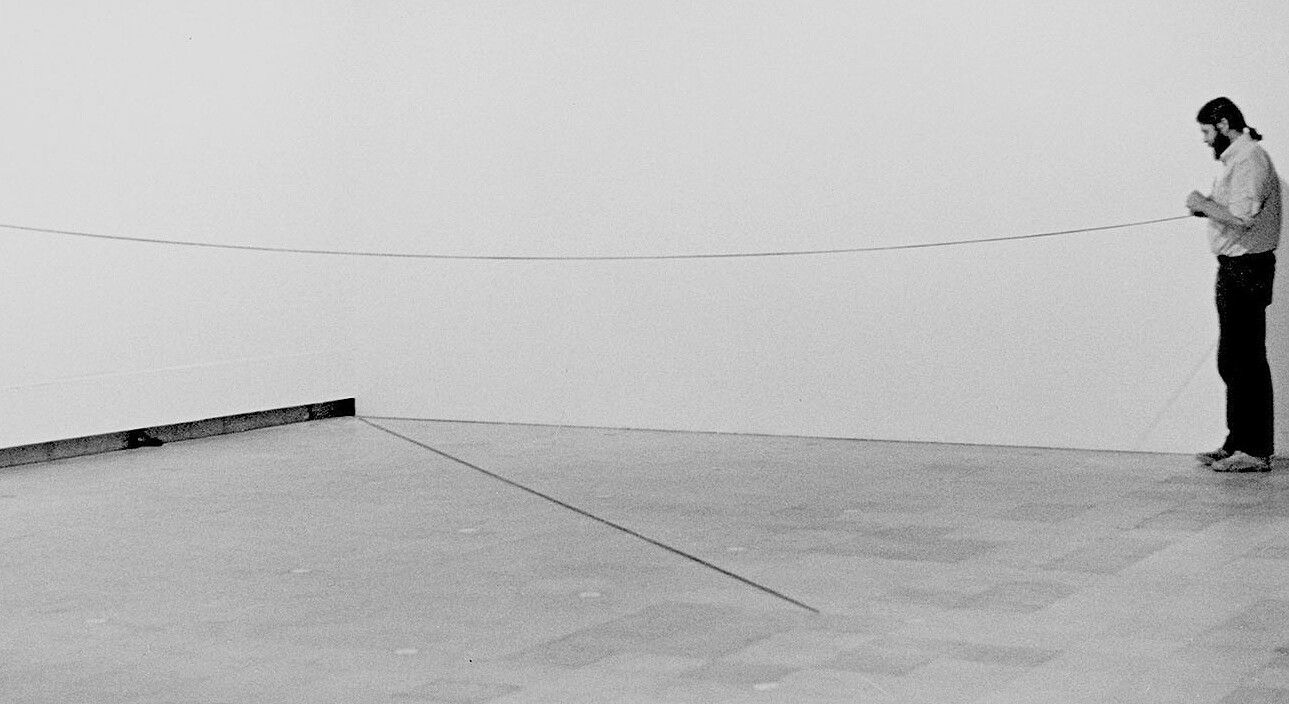 Fred Sandback during the installation of Pier + Ocean: Construction in the Art of the Seventies, Hayward Gallery, London, dated 1980.