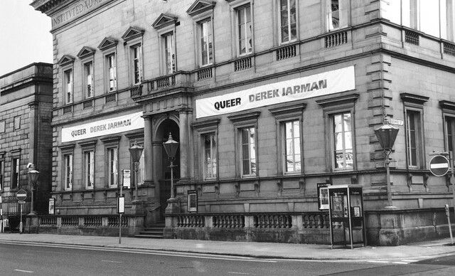 A photo of banners advertising Derek Jarman's exhibition Queer at Manchester Art Gallery in 1992.