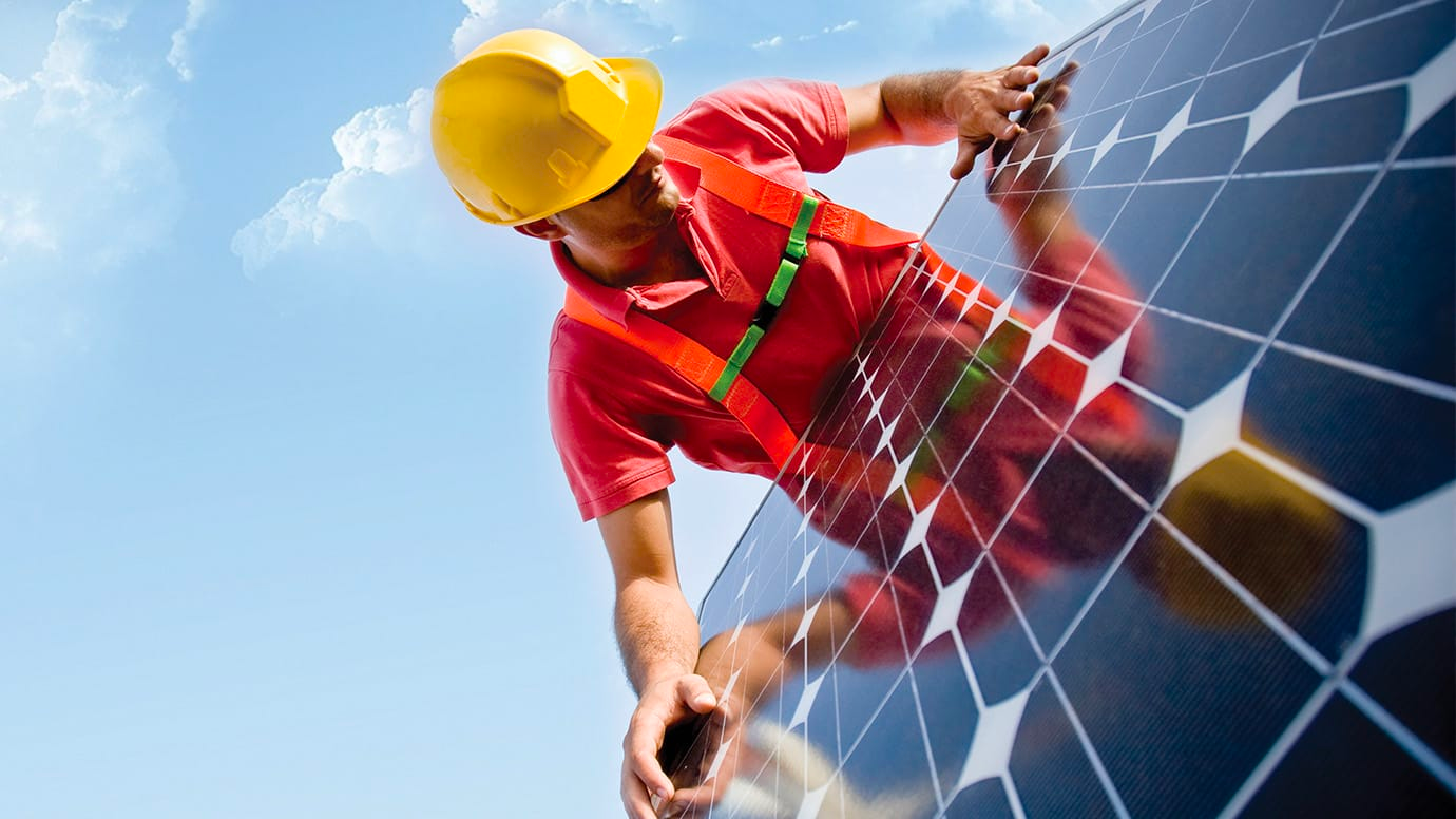 man installing a solar panel