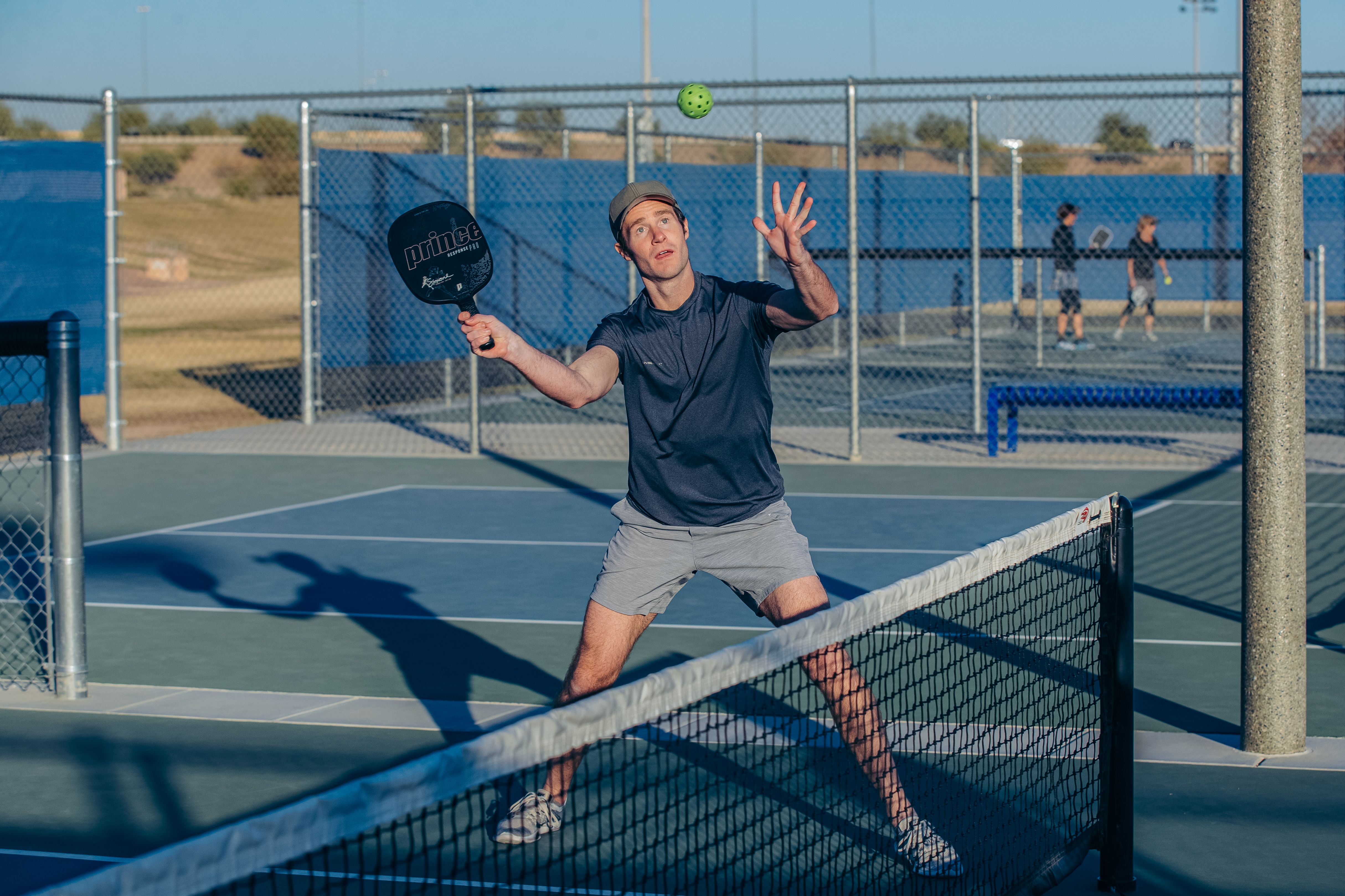 Pickleball player prepares to hit a volley during a game