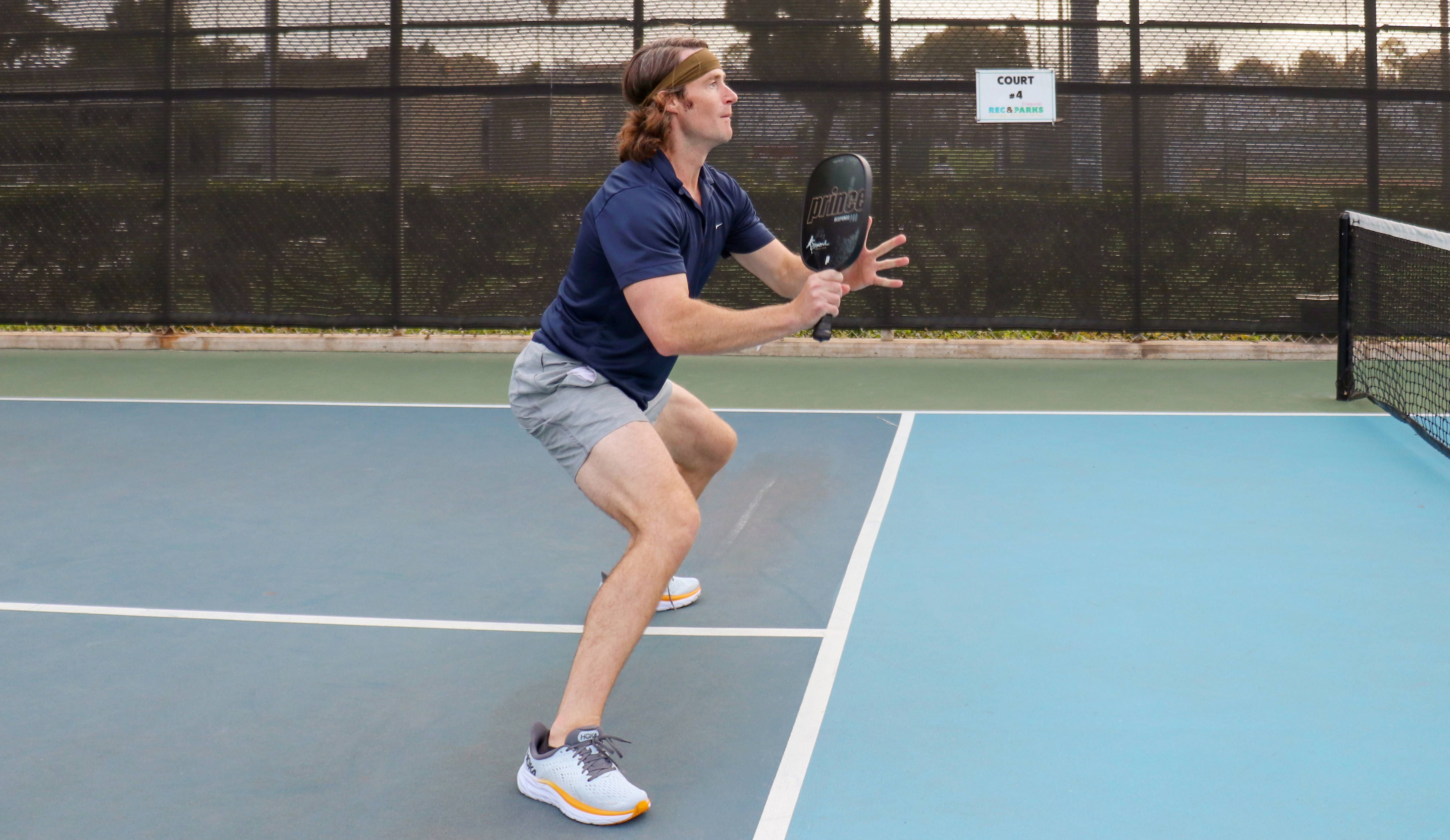 A Man Dressed in Pickleball Clothes and Playing Pickleball