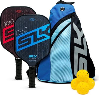 Photo of the two SLK NEO 2.0 by Selkirk pickleball paddles, with a bag and four balls