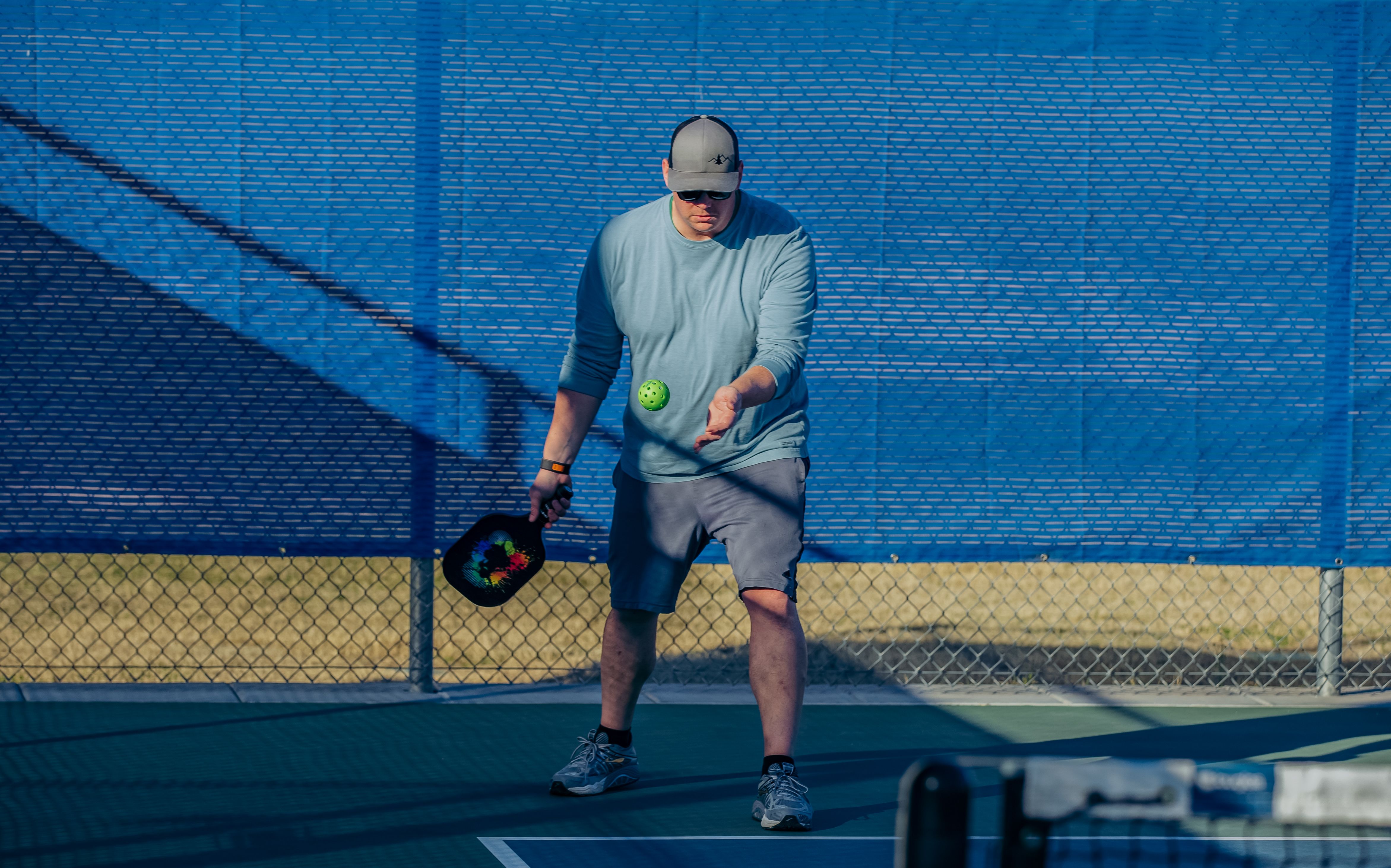 Player prepares to hit a ball in a game of pickleball