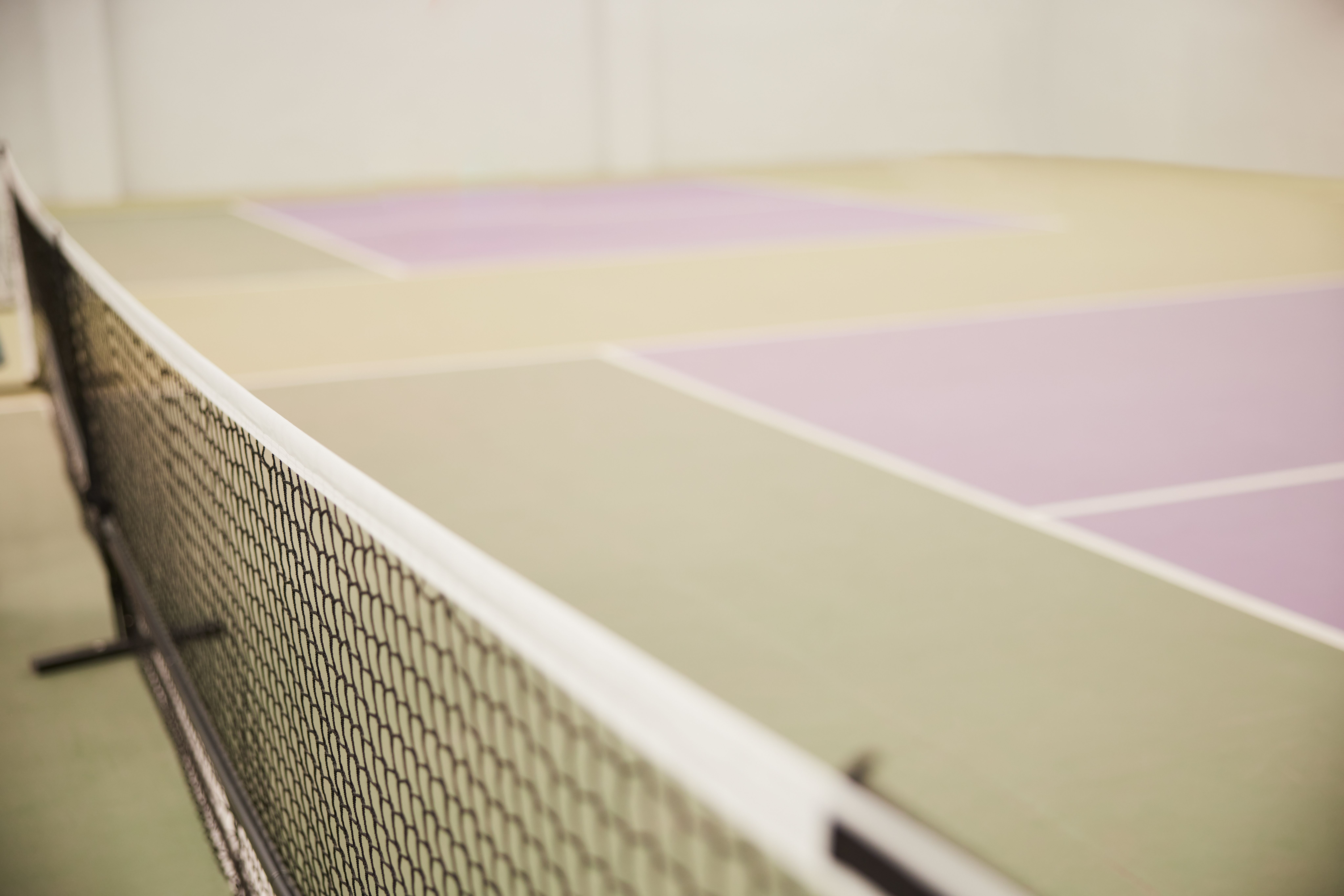 Close-up of a pickleball net on a pickleball court