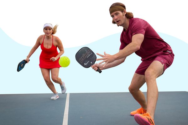Player about to hit a ball in a game of pickleball doubles