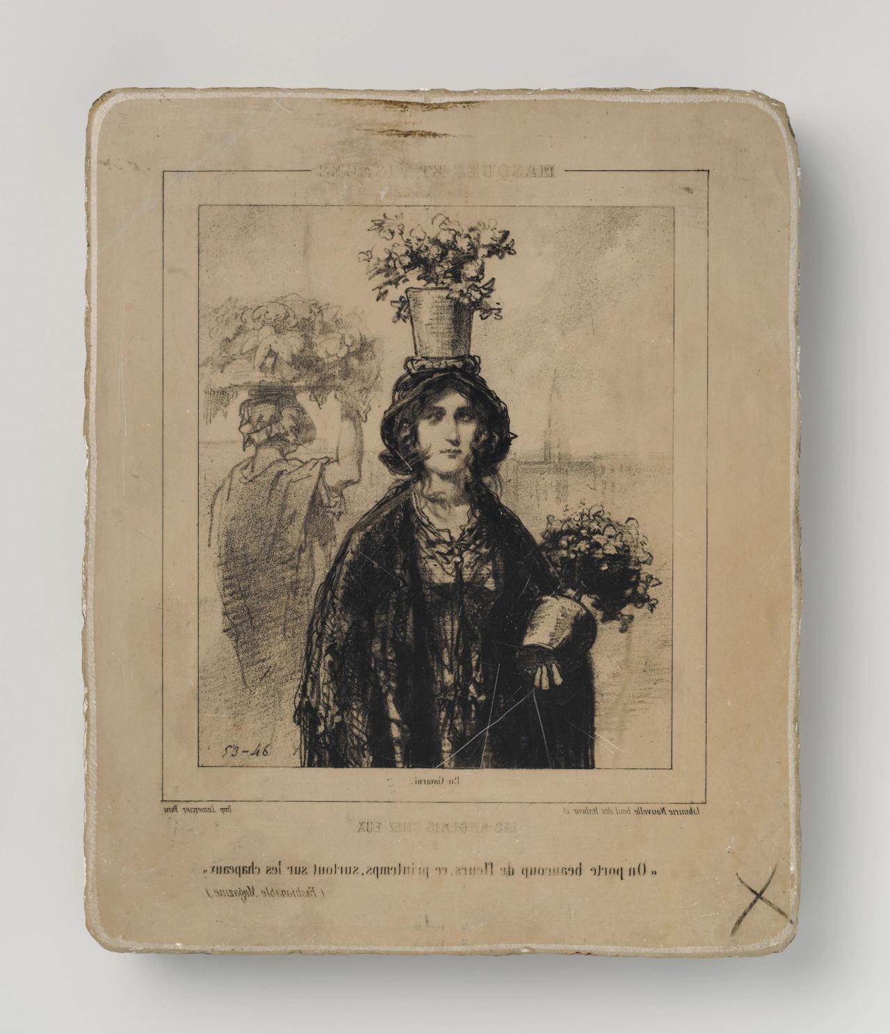 A lithographic stone, photographed with its reversed drawing facing up: a young woman in a dark shawl carries a pot of flowers on her head and a bunch of flowers in the crook of her arm, with a second figure and a hat of flowers sketched behind her. French lettering runs beneath the image.