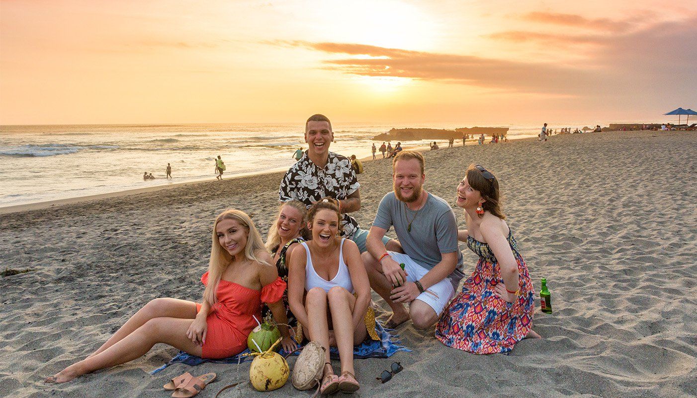 Bali group on beach at sunset