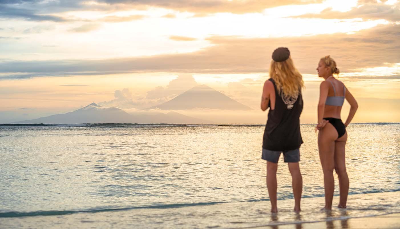 Two travellers standing on a Balinese beach