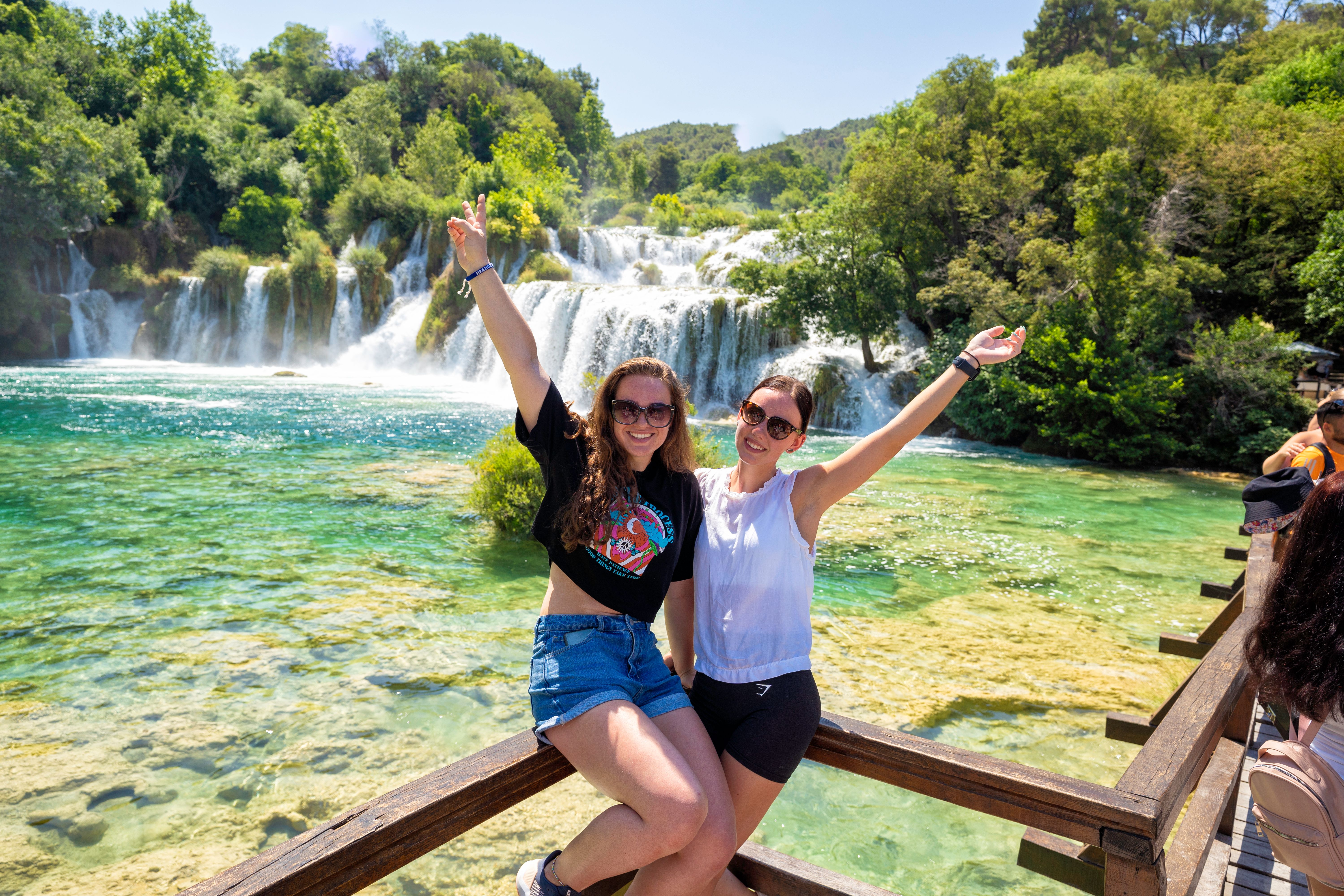 Girls at a waterfall in Croatia