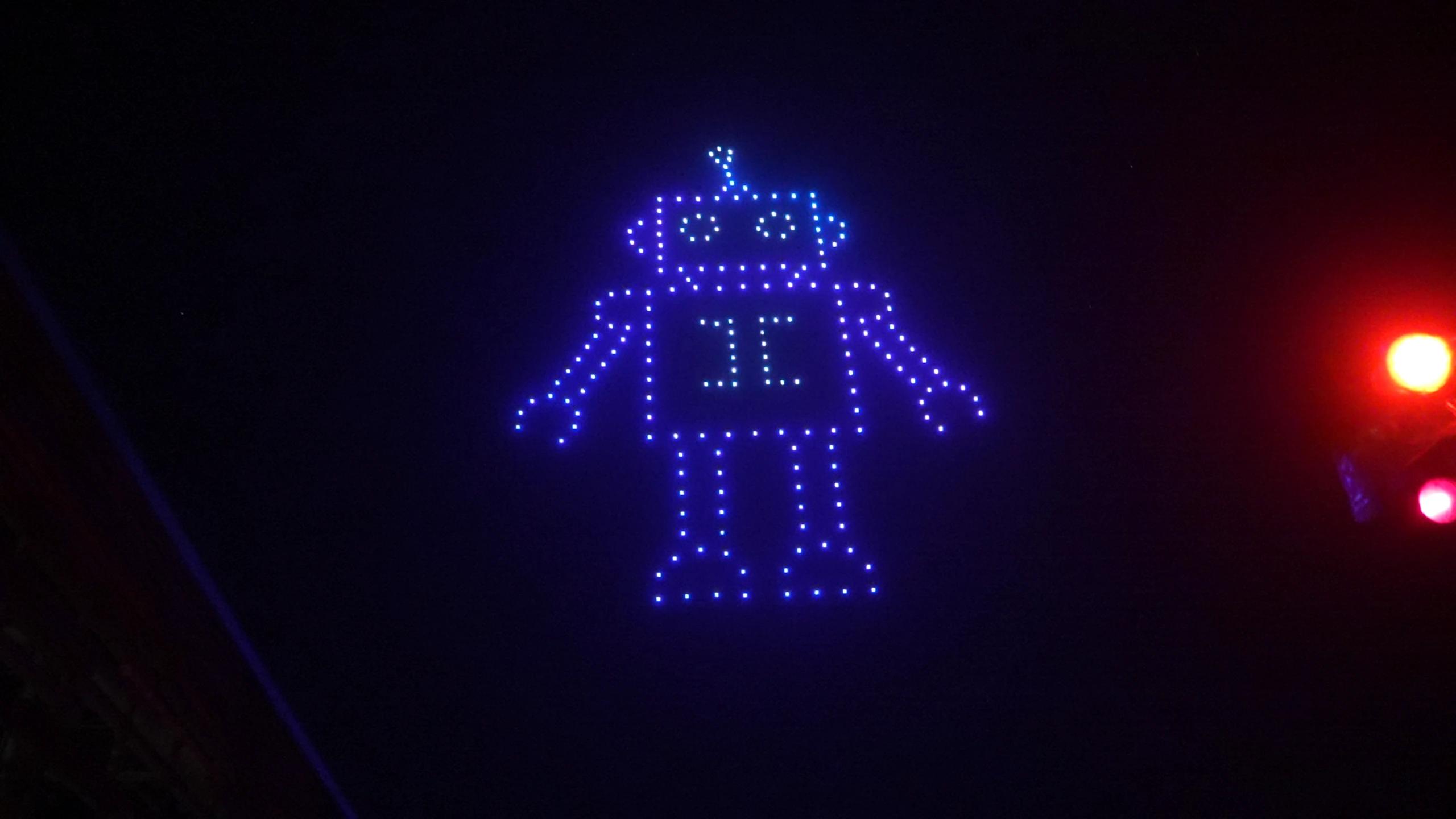 Blue robot character in the Christina and Andrew wedding drone show at Alila Villas Uluwatu.