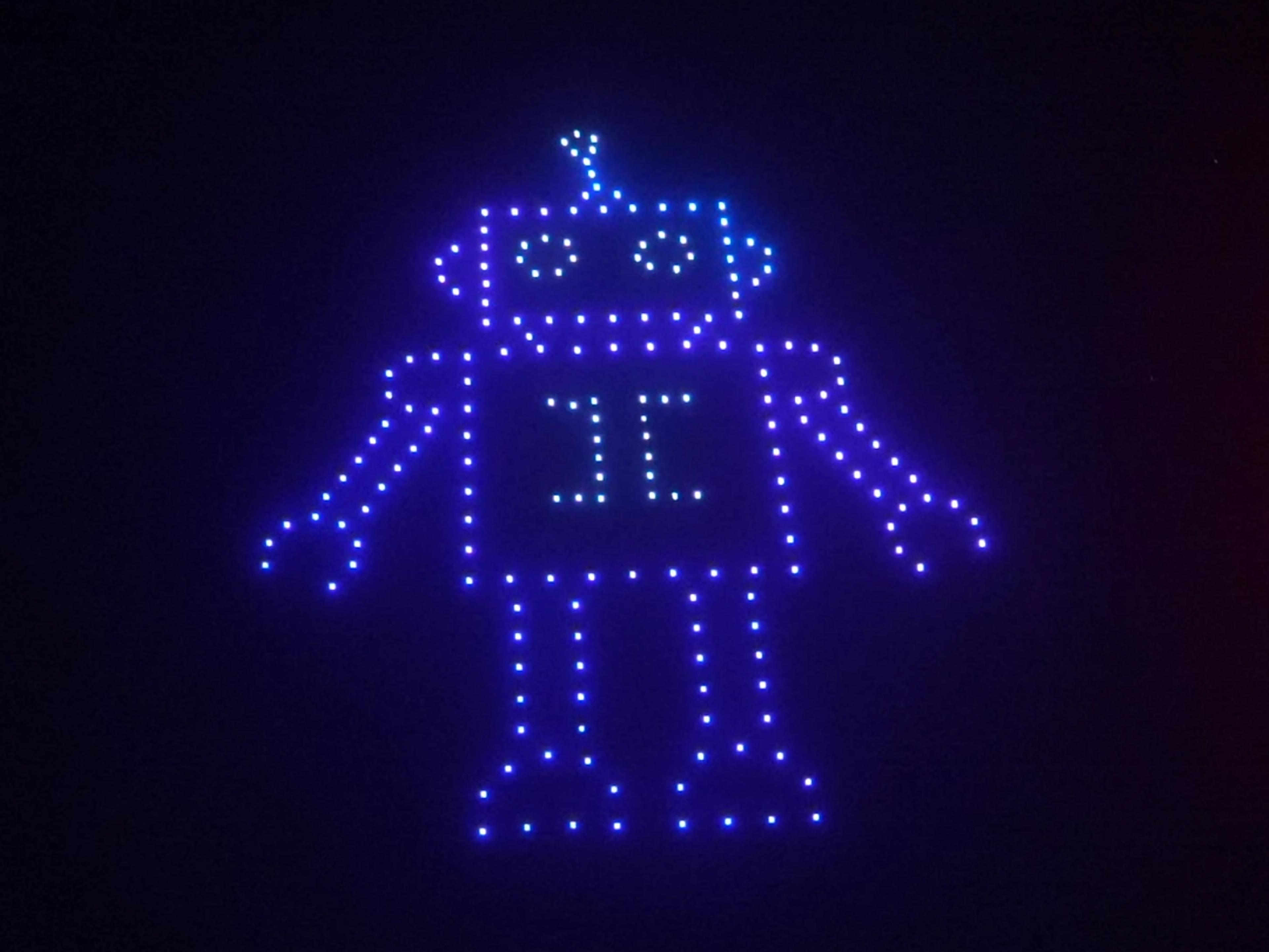 Blue robot character in the Christina and Andrew wedding drone show at Alila Villas Uluwatu.