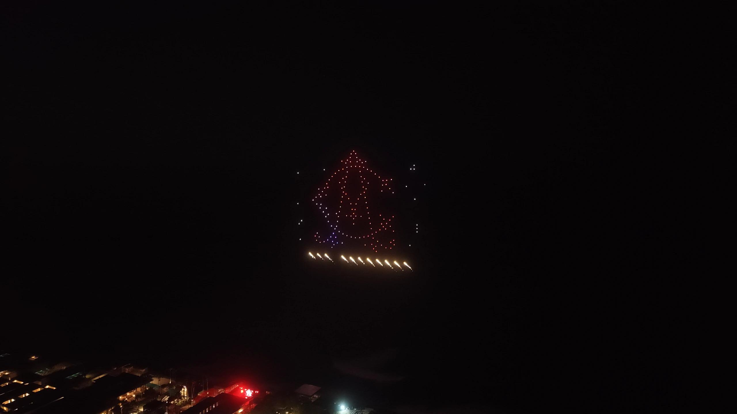 Bell-shaped drone formation with aerial pyrotechnic effects at Christina and Andrew’s wedding, iDrone’s second pyrodrones show in Bali.