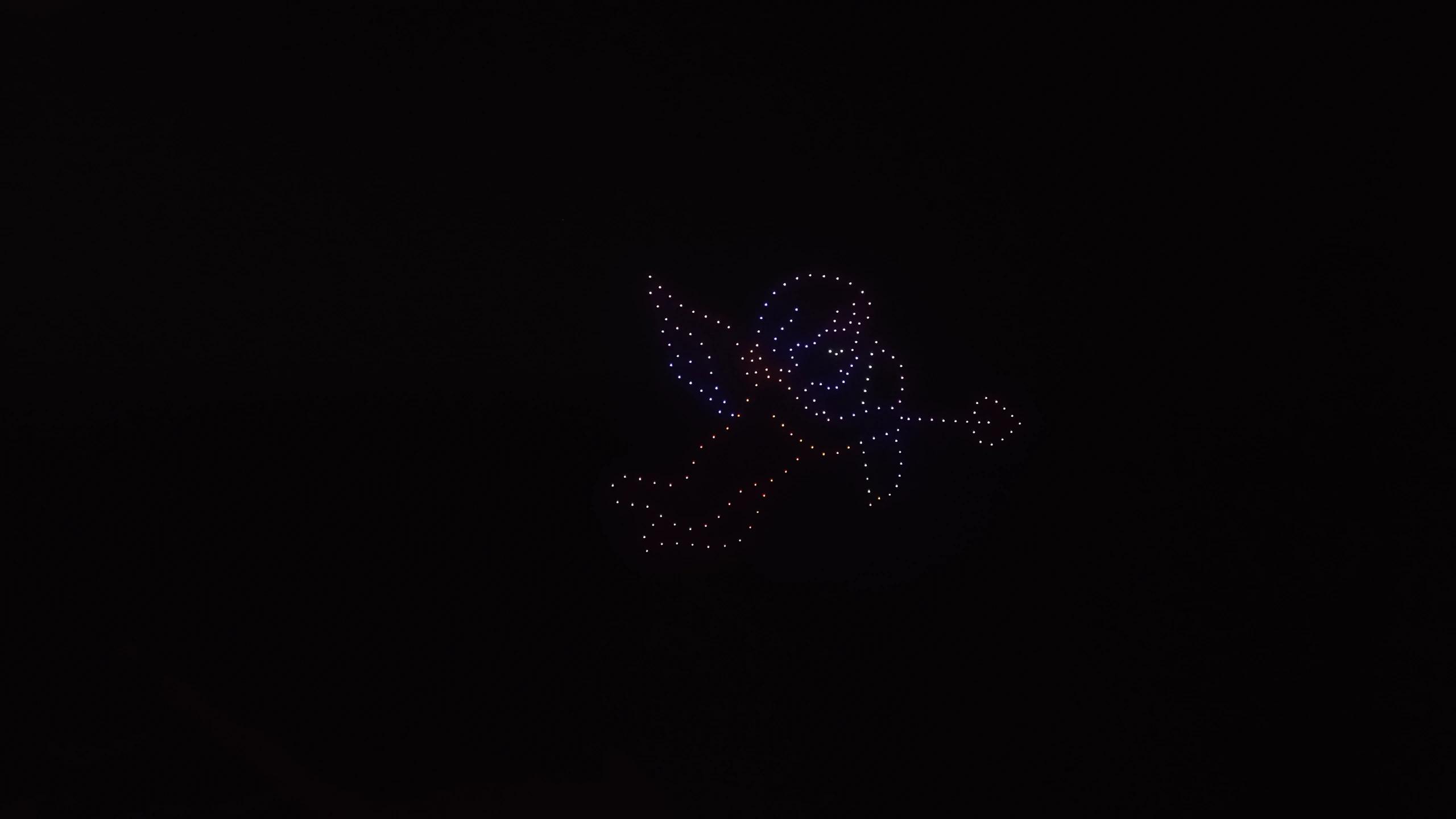 Cupid with a bow and arrow formed by drones for Christina and Andrew in Uluwatu, Bali.