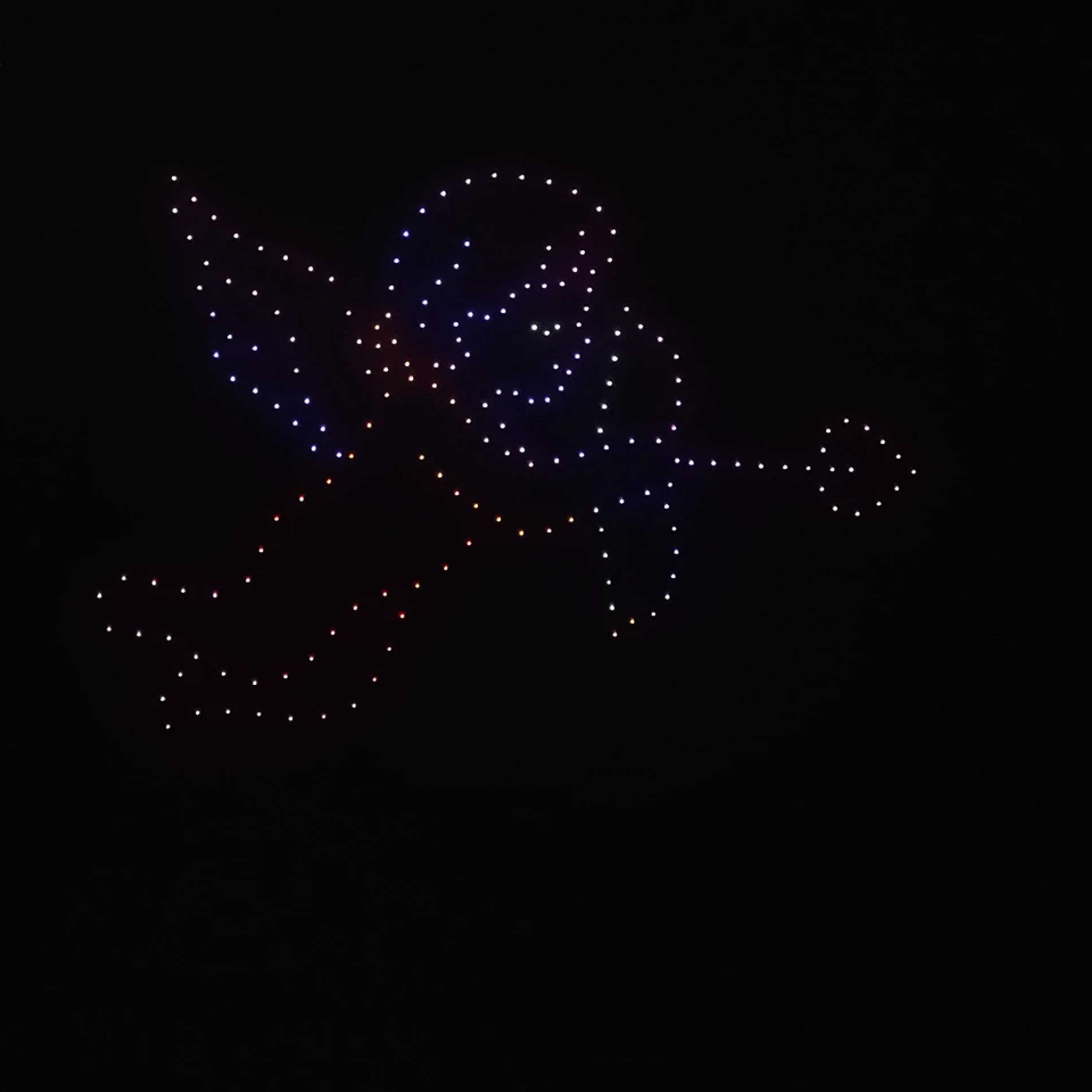 Cupid with a bow and arrow formed by drones for Christina and Andrew in Uluwatu, Bali.