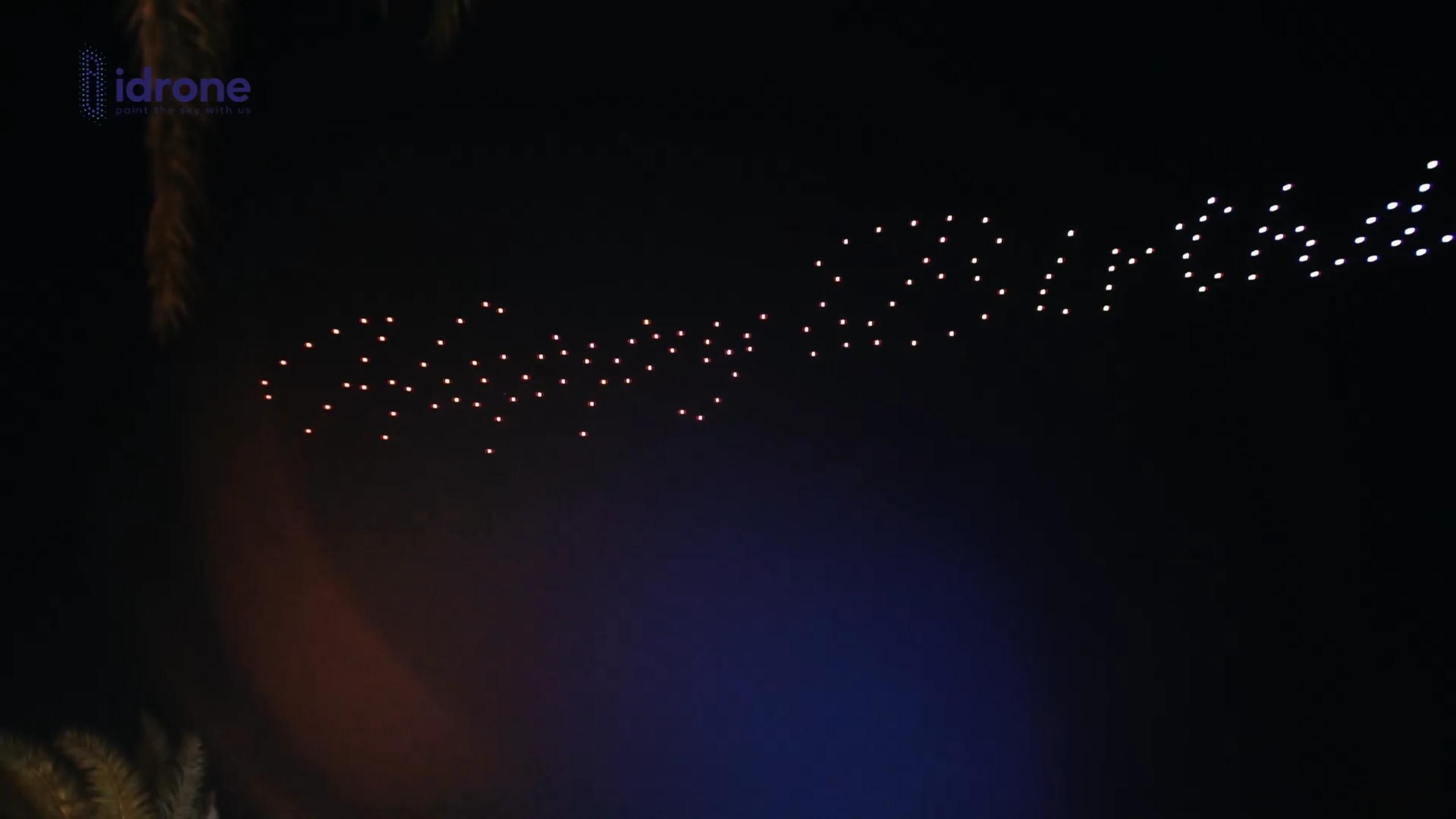 Abstract opening wave in warm and white lights above Susan Birthday at Dreamville Beach Club PIK 2