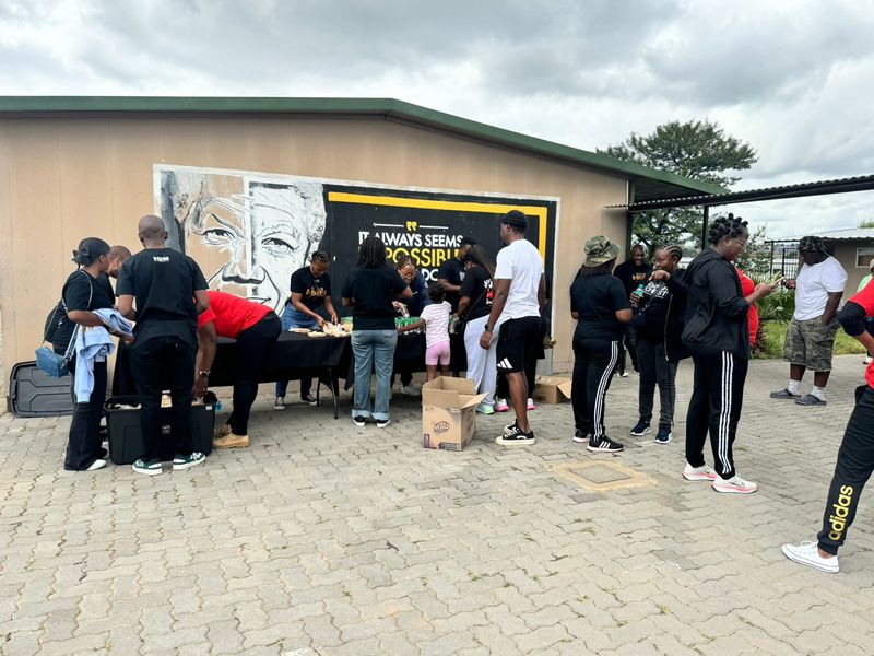 Members of the Hope Connects community zones prepare and arrange dignity packs at the school precinct ahead of the distribution